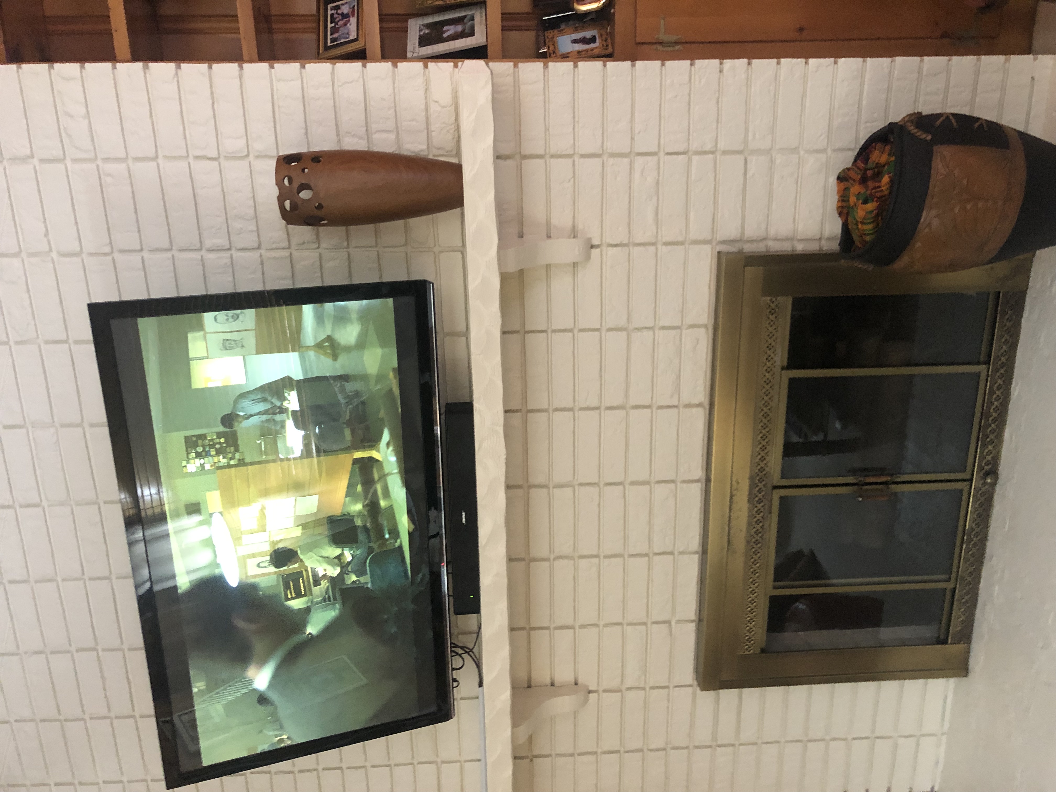 Fixed TV mounting on drywall wall in living room, service area