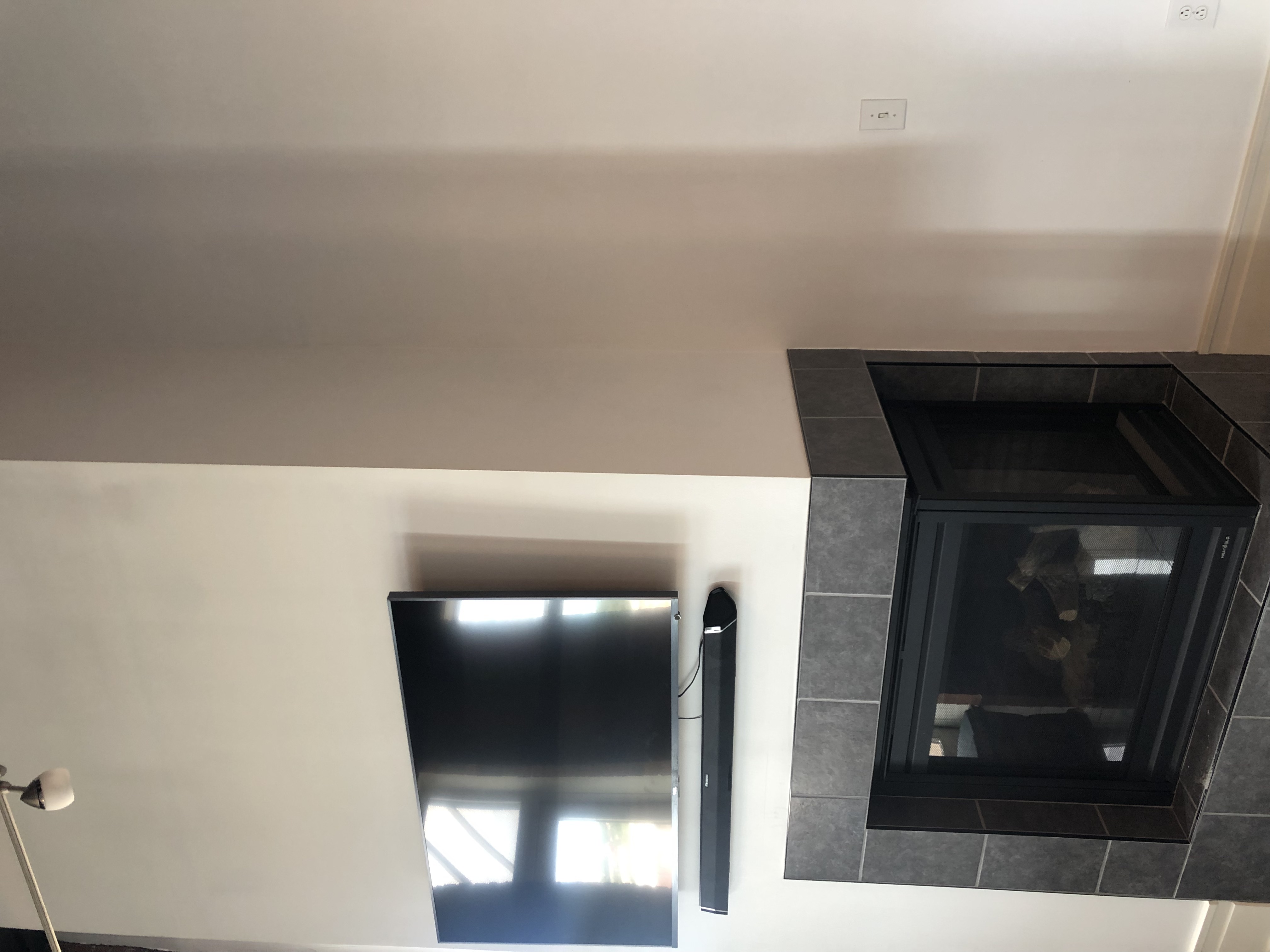 Fixed TV mounting on drywall wall in living room, Charlotte NC