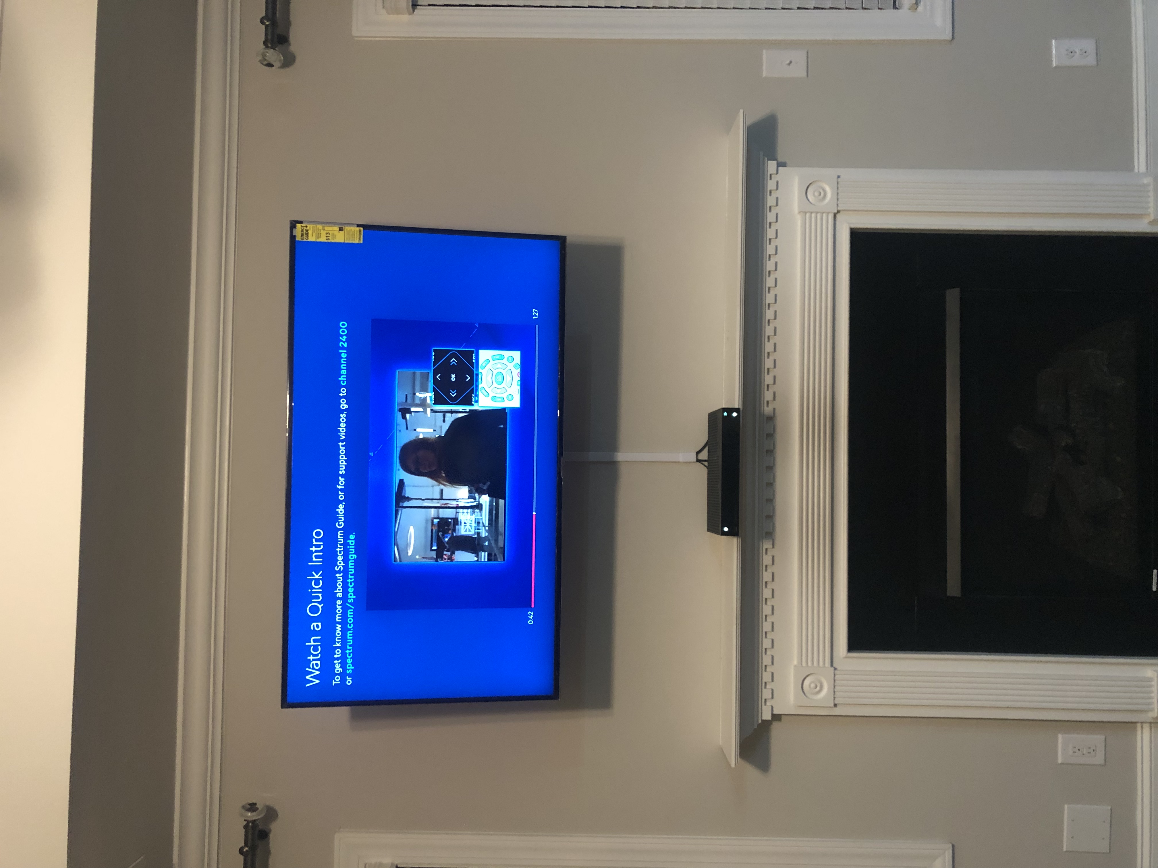 Full-motion TV mounting on drywall wall in living room, service area