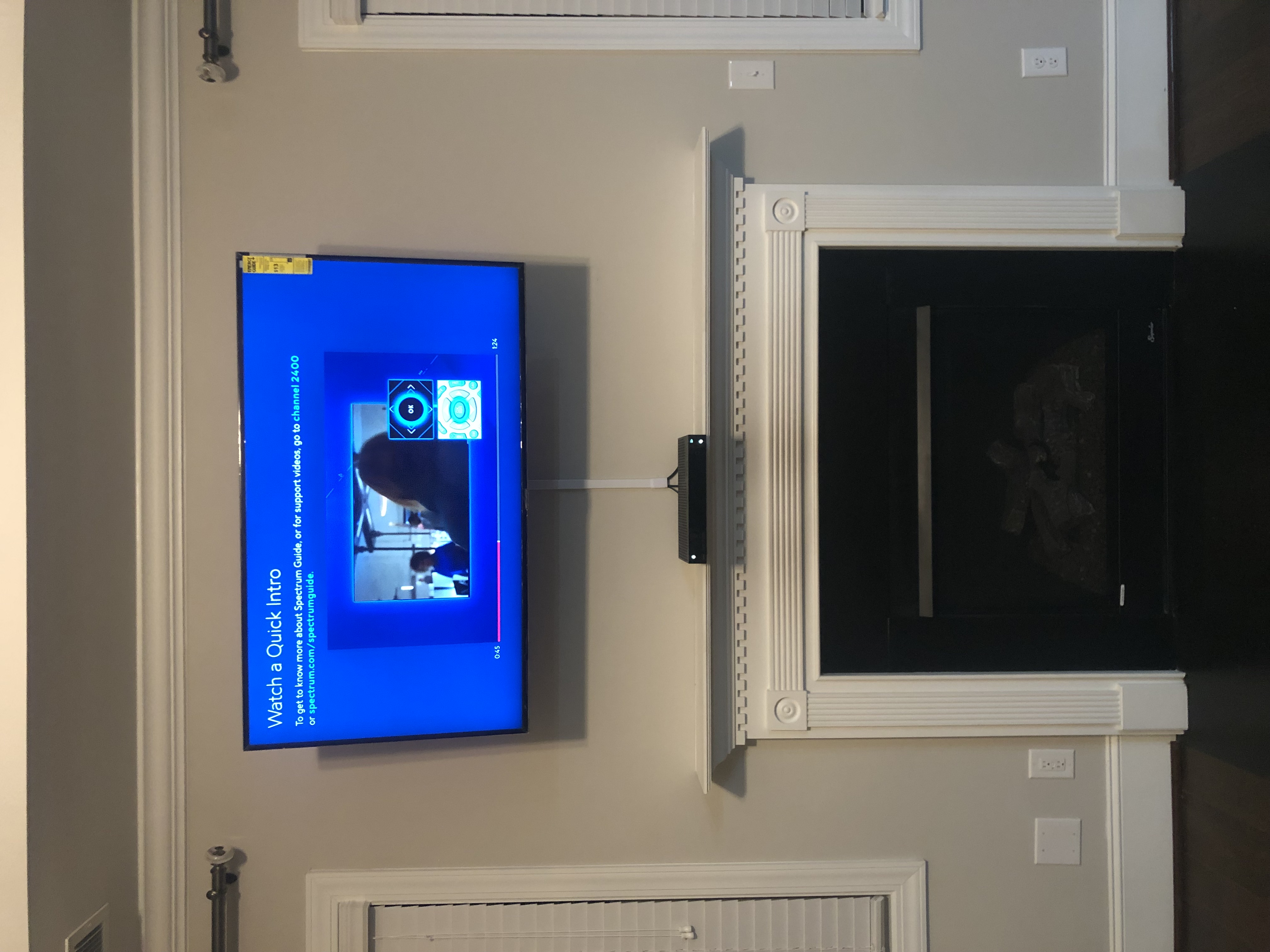 Tilting TV mounting on drywall wall in living room, service area