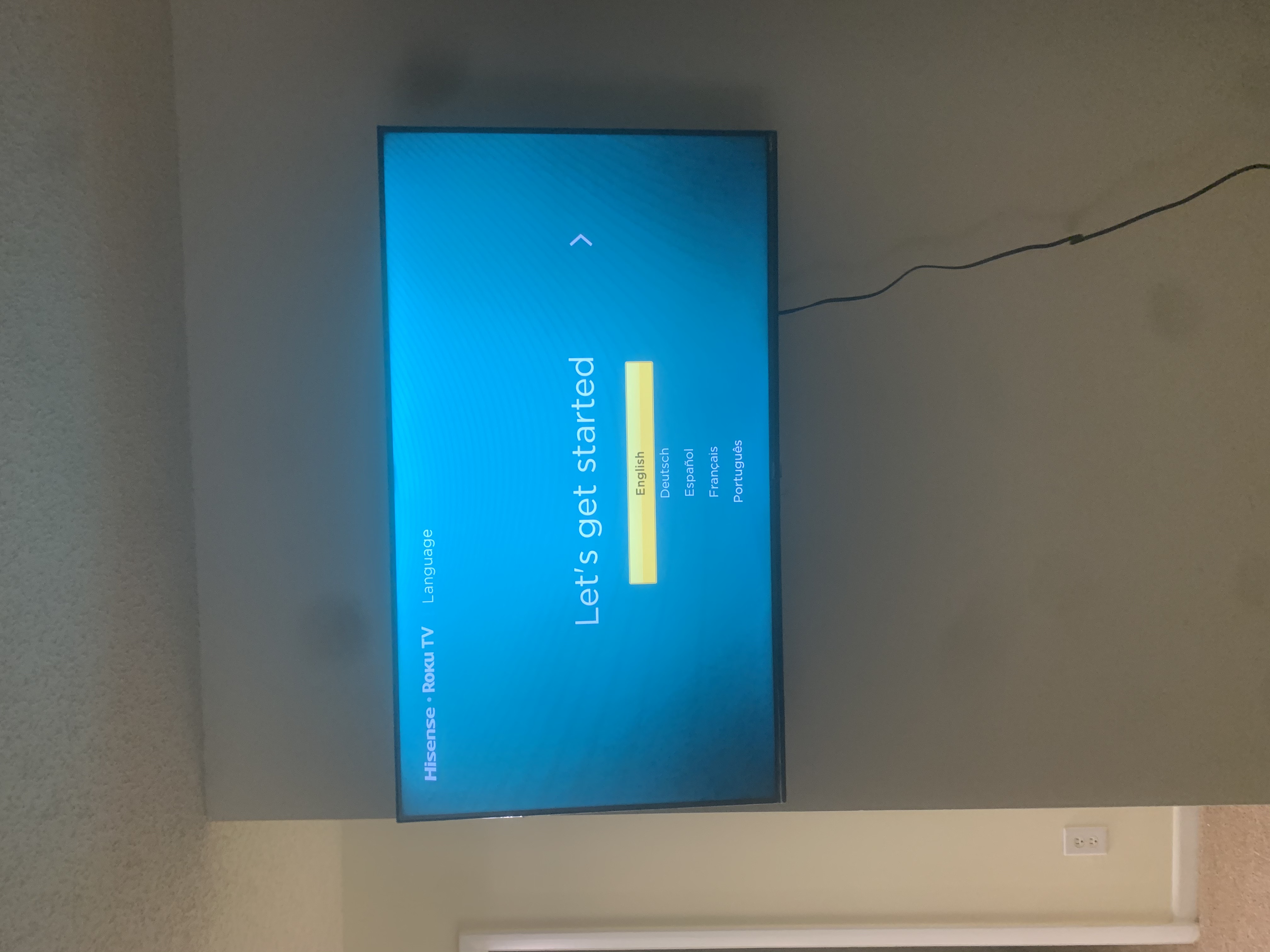 Tilting TV mounting on drywall wall in living room, service area