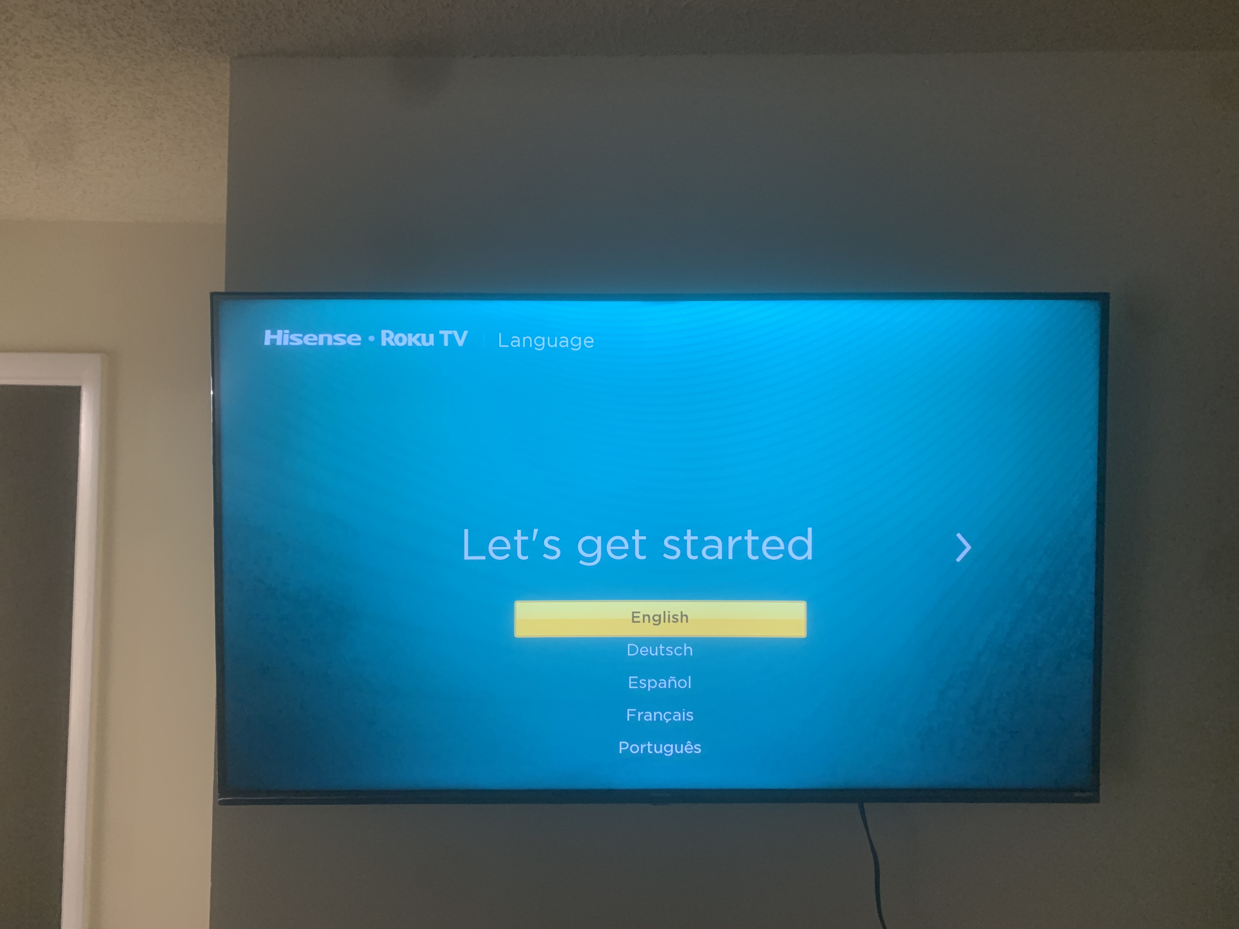 Full-motion TV mounting on drywall wall in living room, service area