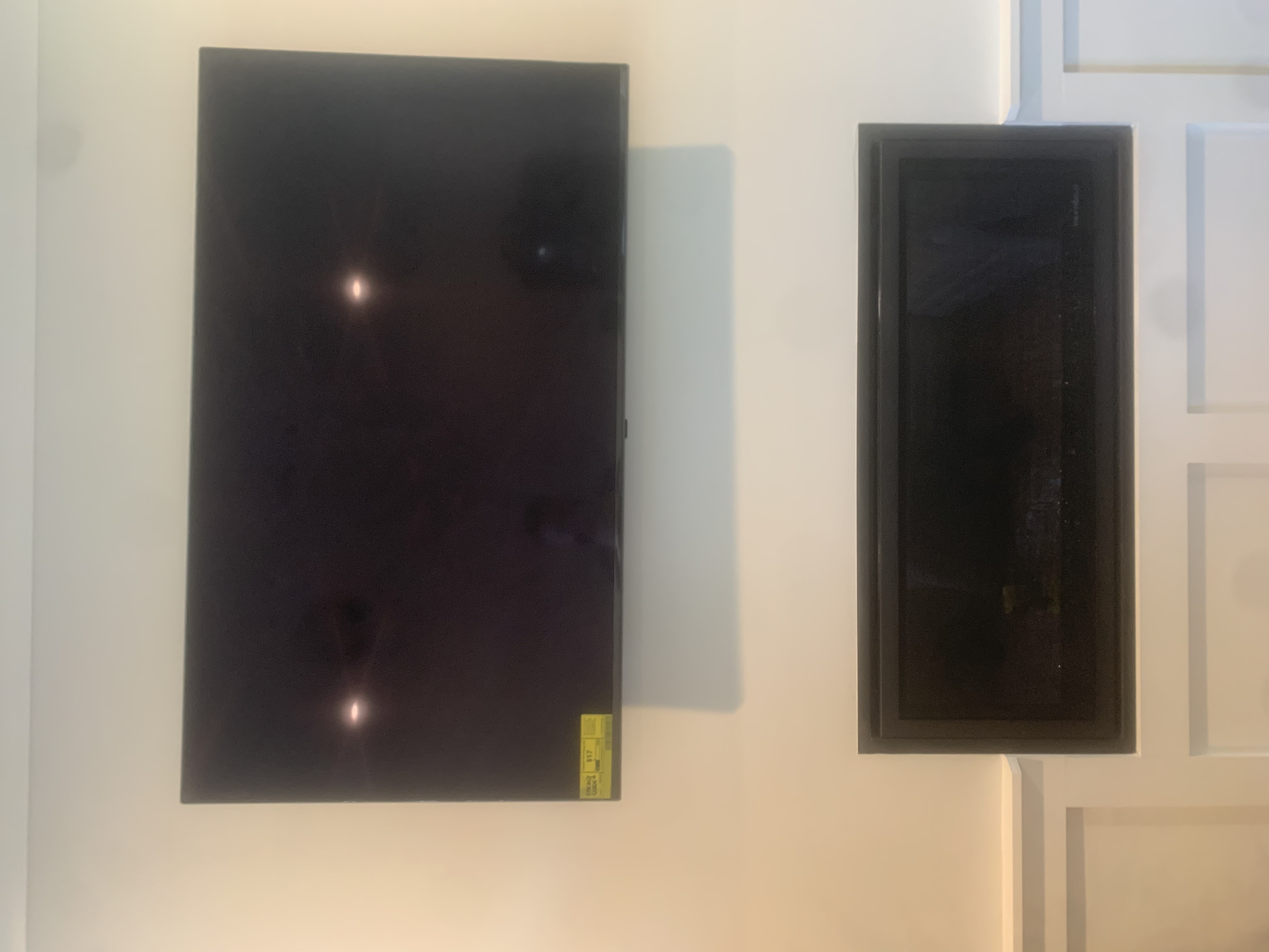 Fixed TV mounting on drywall wall in living room, service area