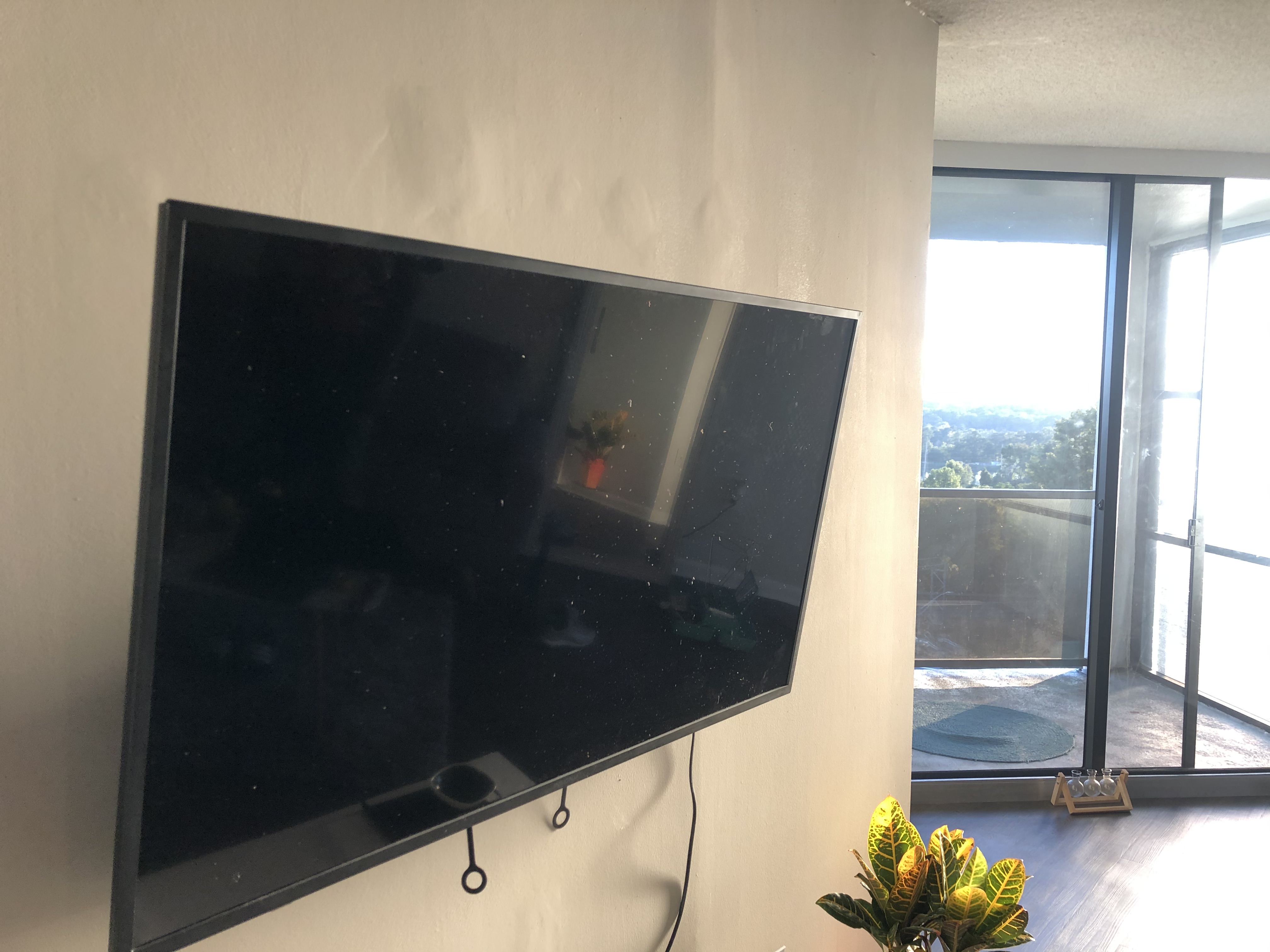 Full-motion TV mounting on drywall wall in living room, Columbia SC