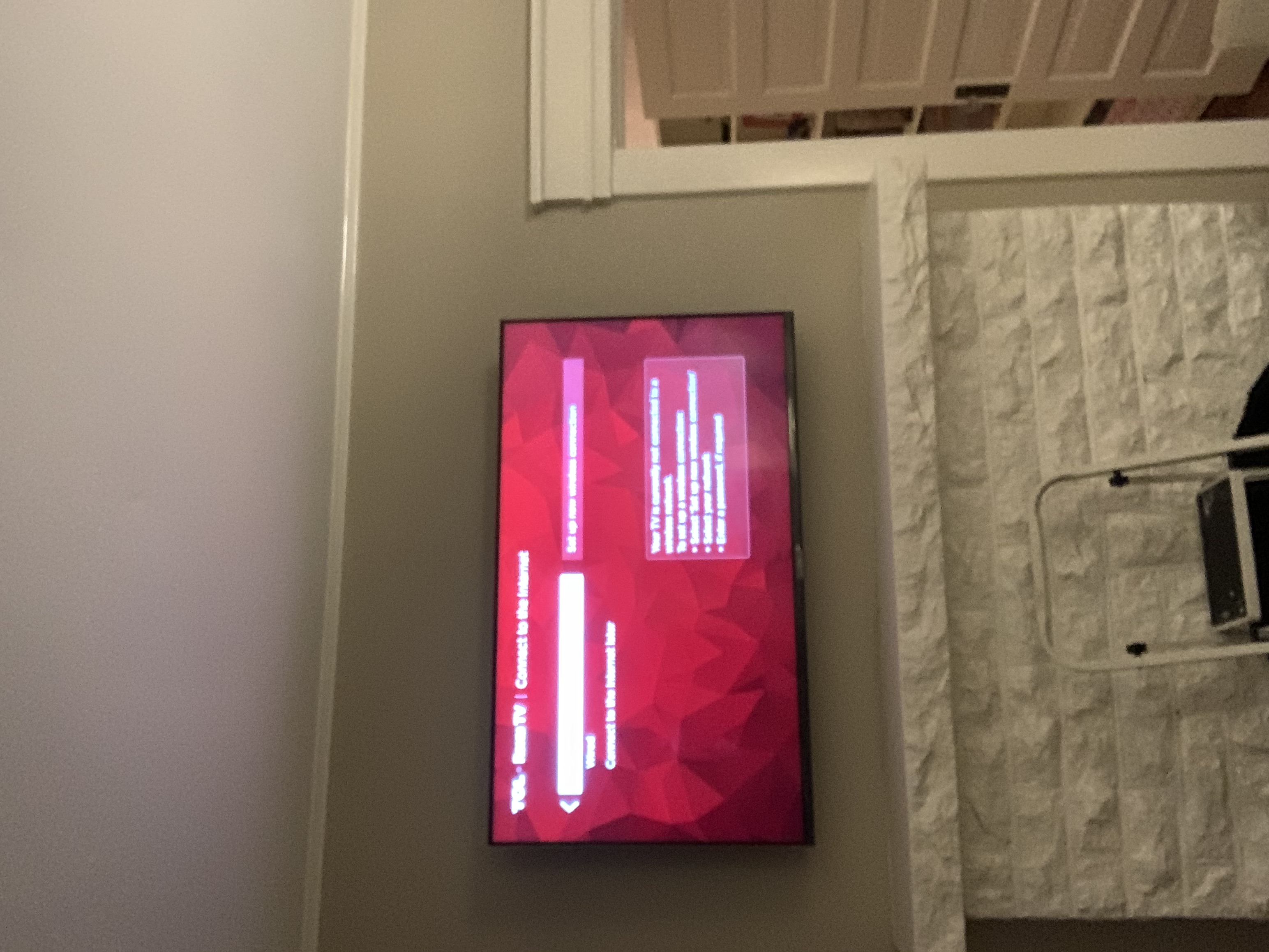 Full-motion TV mounting on drywall wall in living room, Charlotte NC