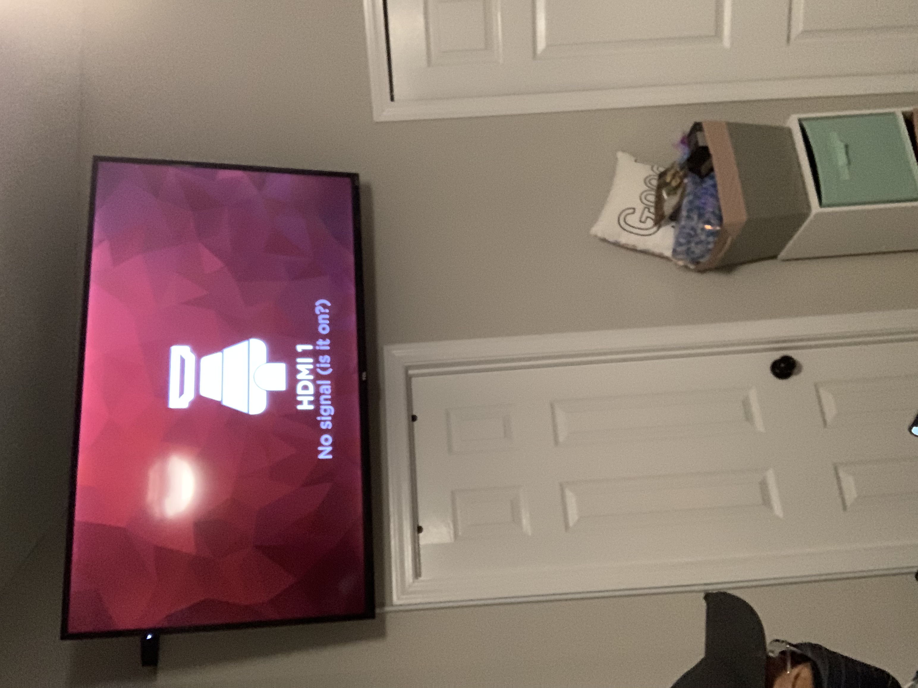 Tilting TV mounting on drywall wall in living room, service area