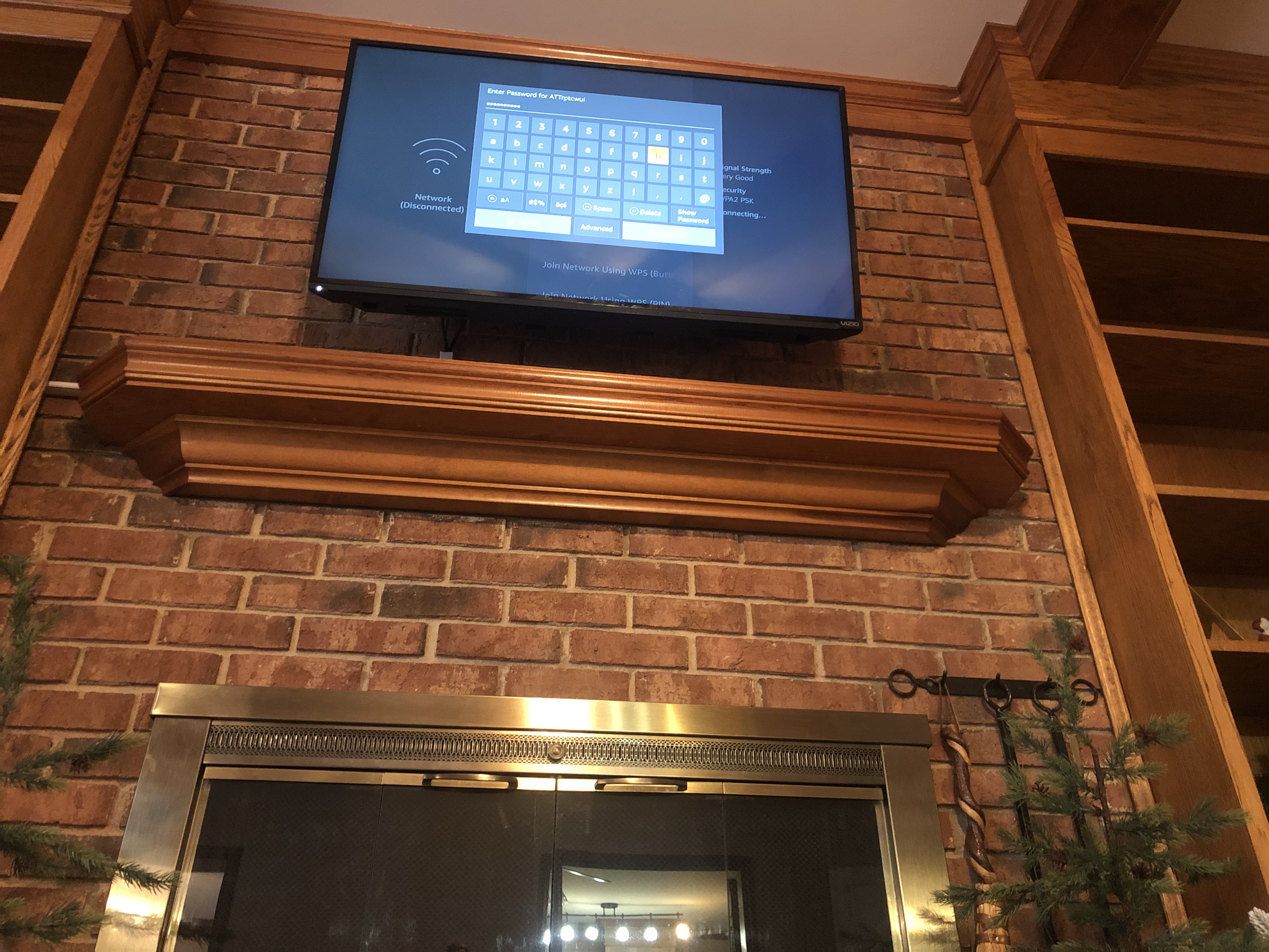 Tilting TV mounting on drywall wall in living room, service area