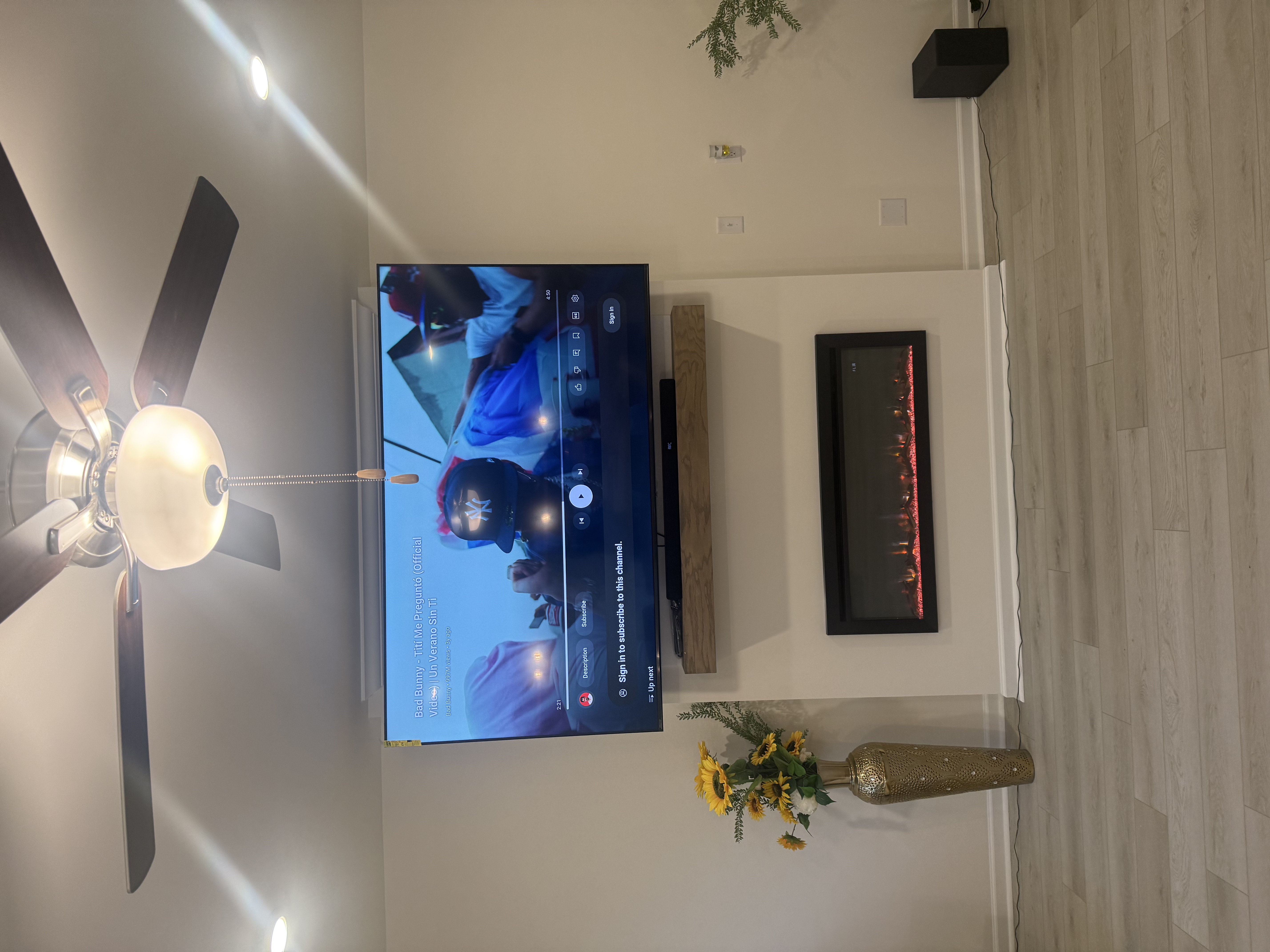 Full-motion TV mounting on drywall wall in living room, service area