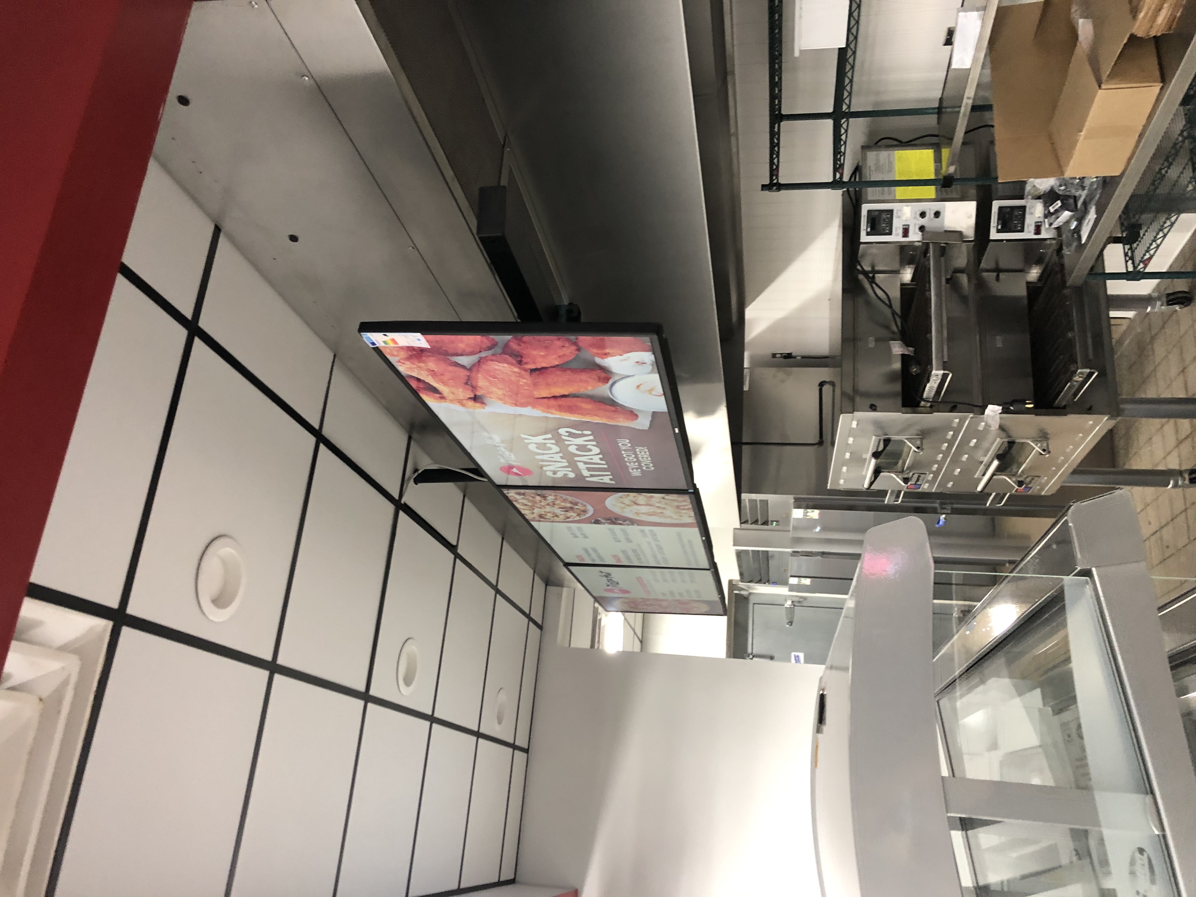 Fixed TV mounting on drywall wall in living room, service area