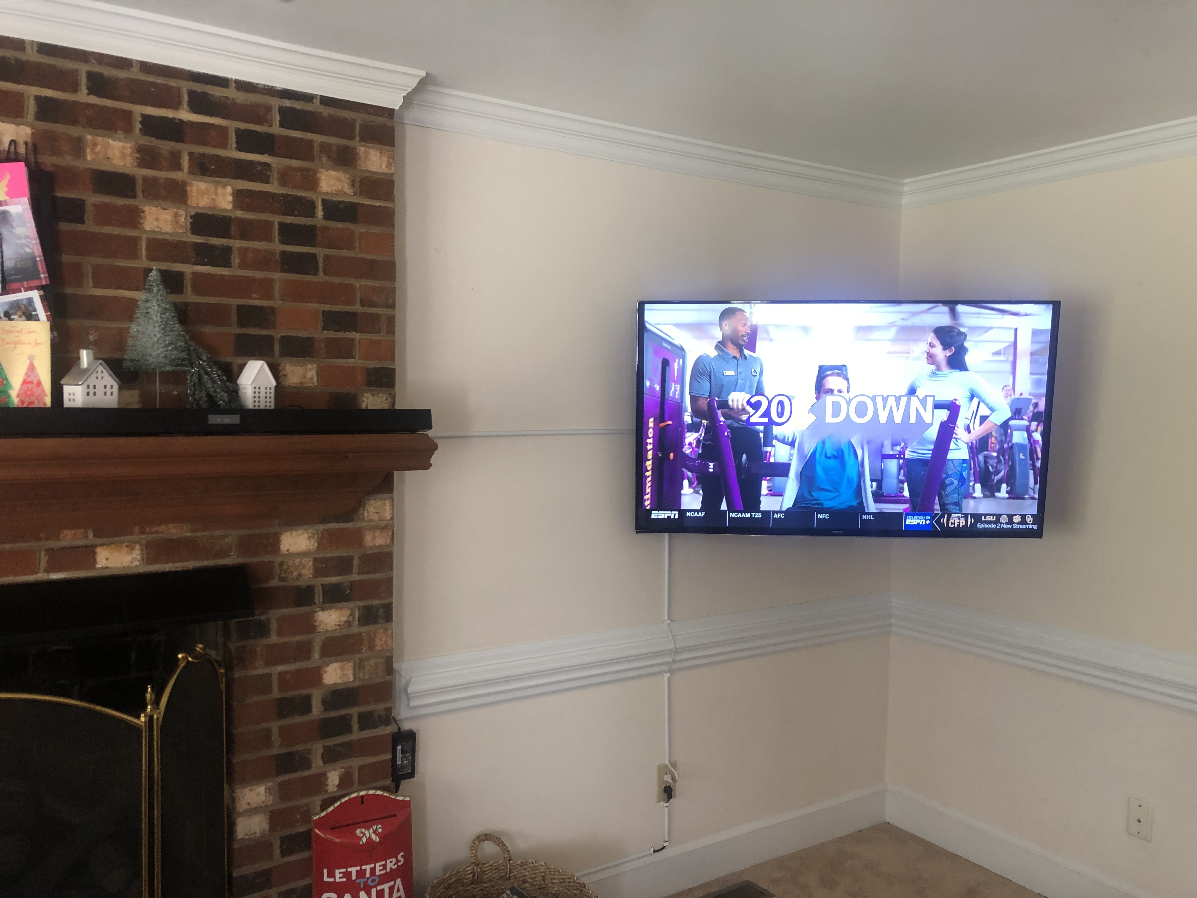 Tilting TV mounting on drywall wall in living room, service area