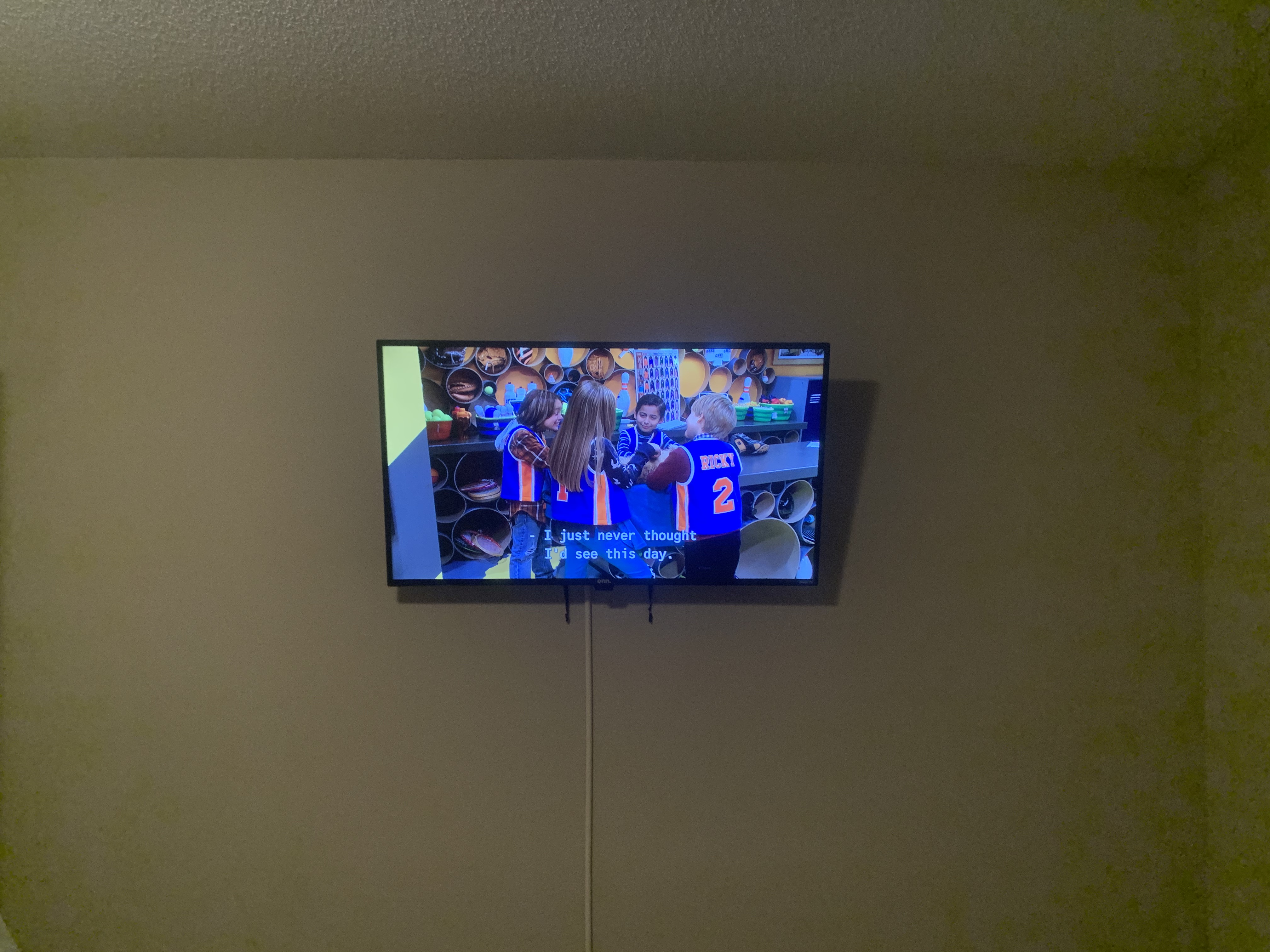 Tilting TV mounting on drywall wall in living room, service area