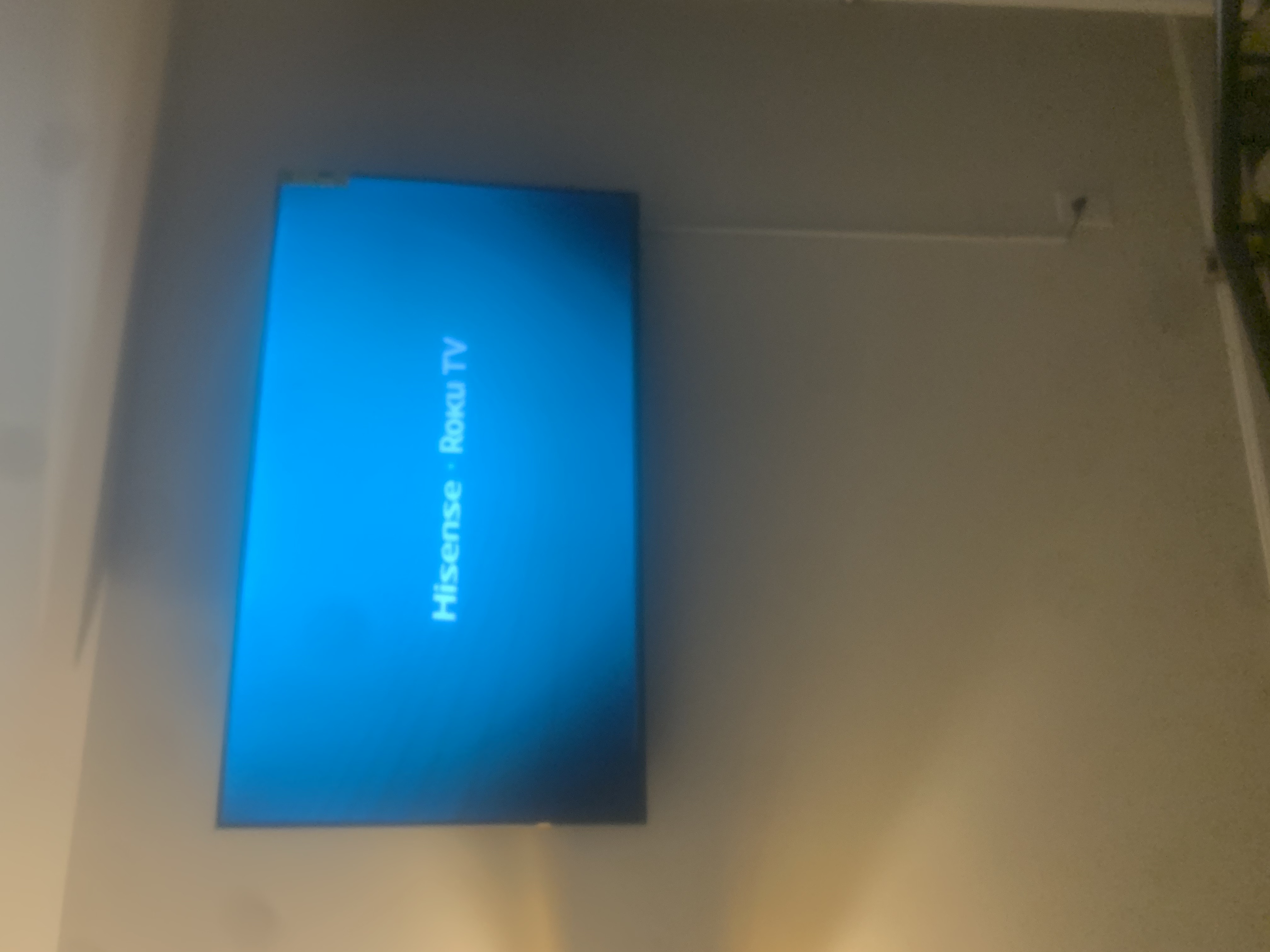 Fixed TV mounting on drywall wall in living room, service area