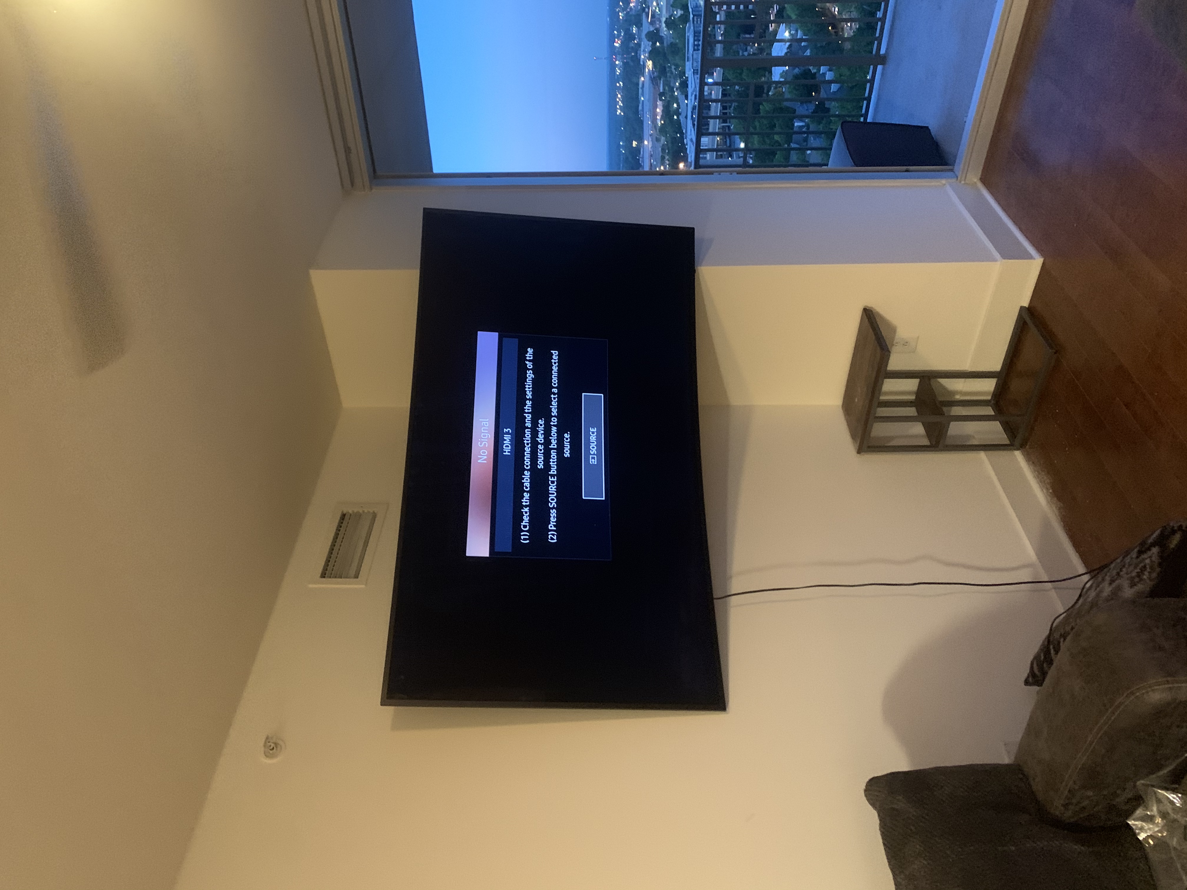 Fixed TV mounting on drywall wall in living room, service area