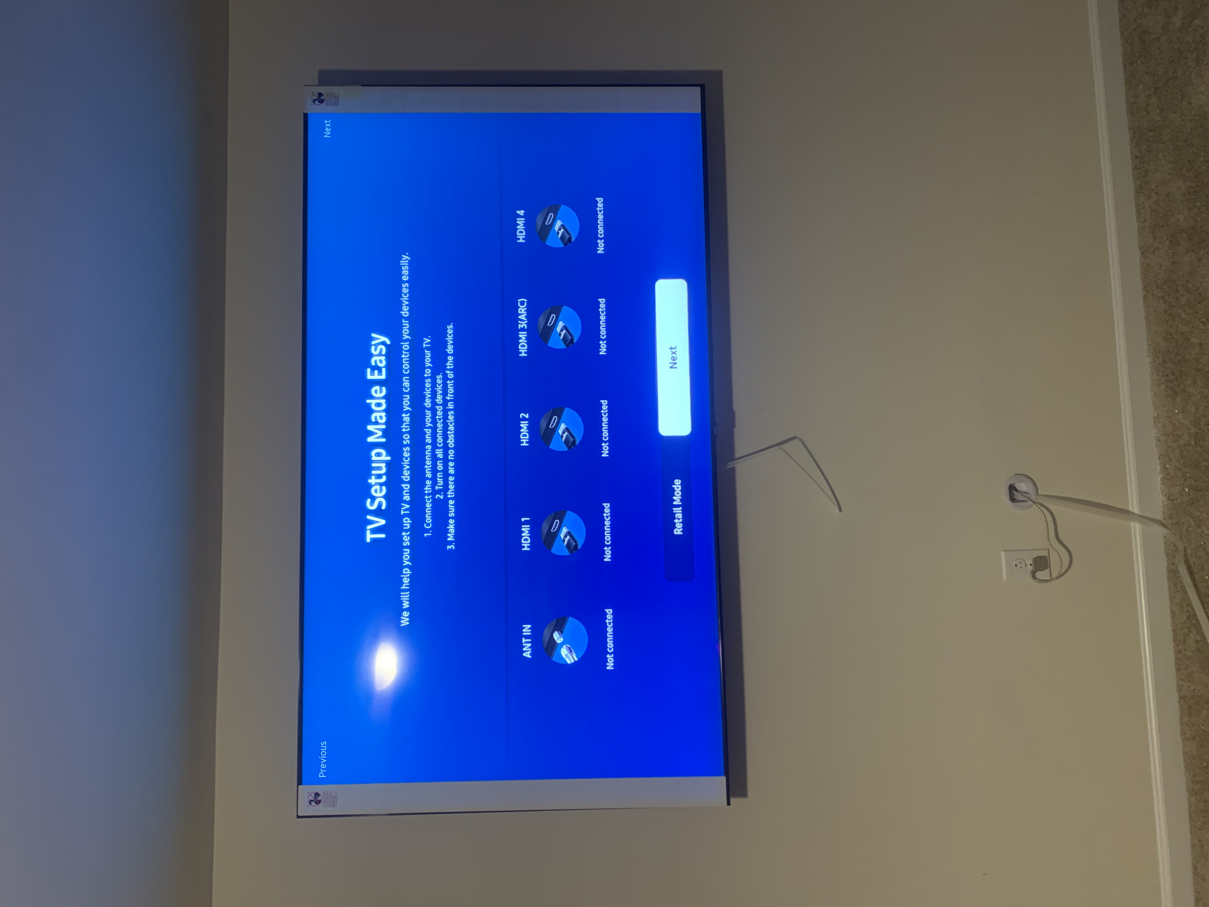 Full-motion TV mounting on drywall wall in living room, Charlotte NC