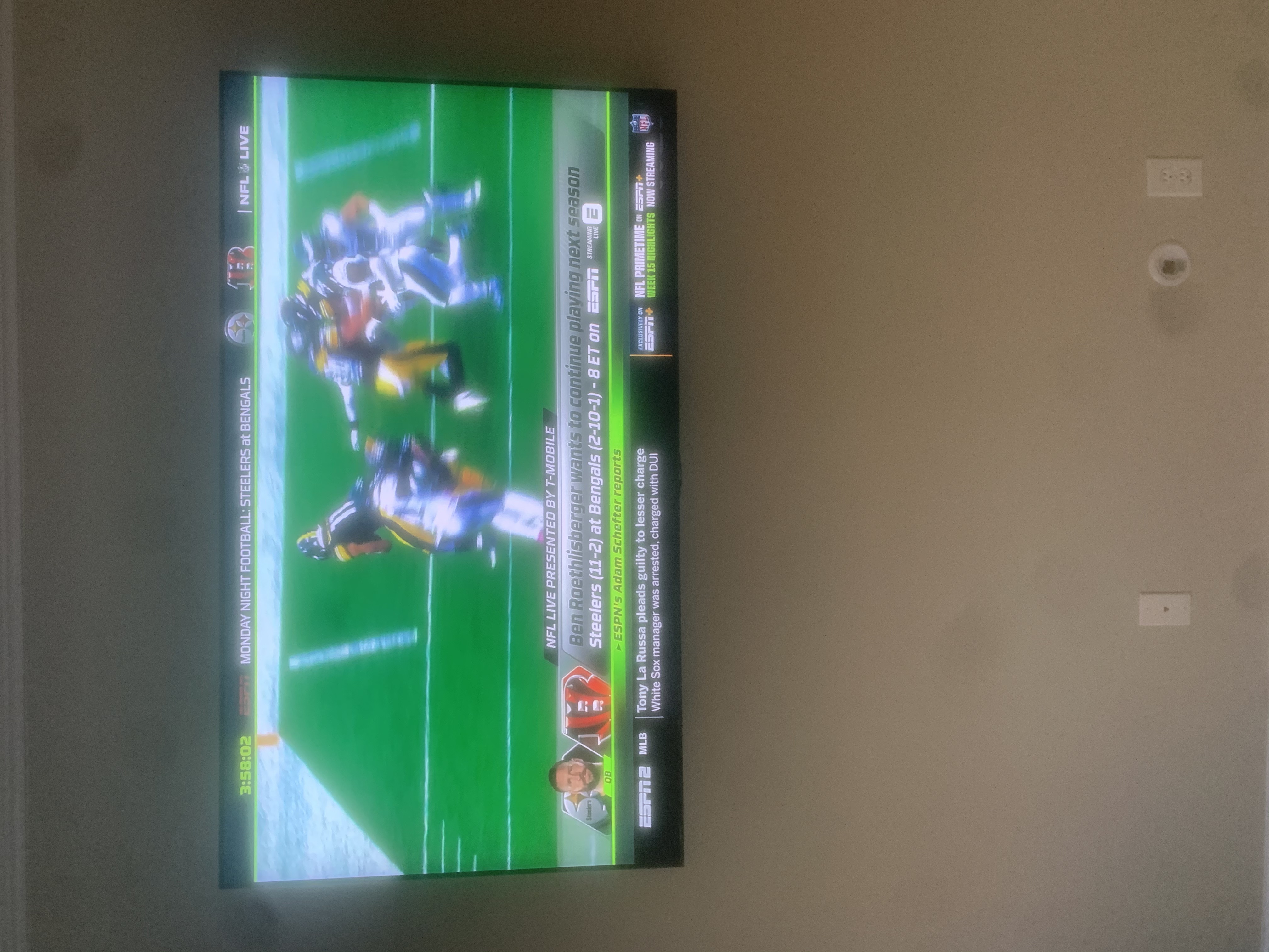 65-inch TV mounted above fireplace with concealed cables in Charleston, SC