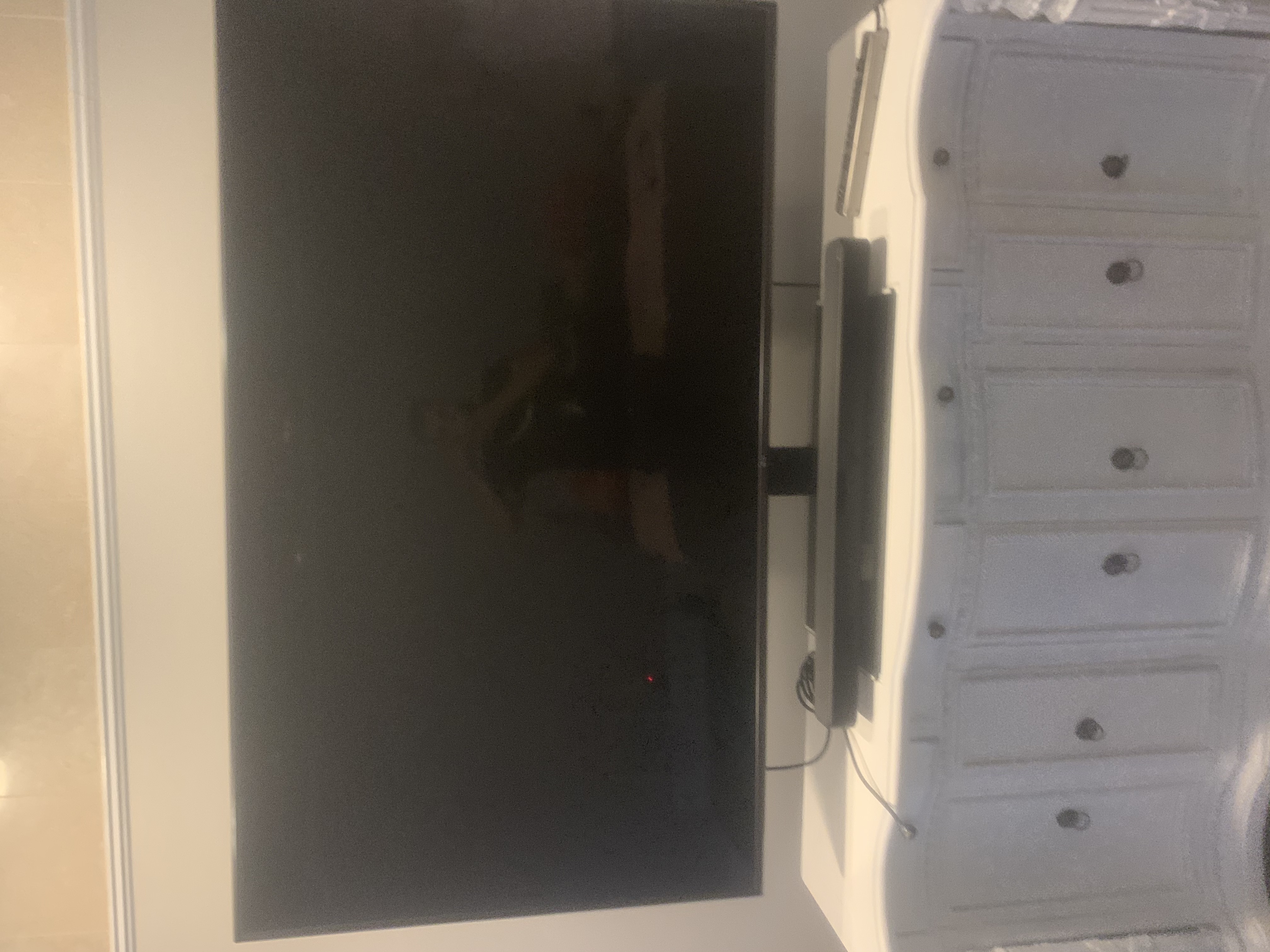 Fixed TV mounting on drywall wall in living room, service area