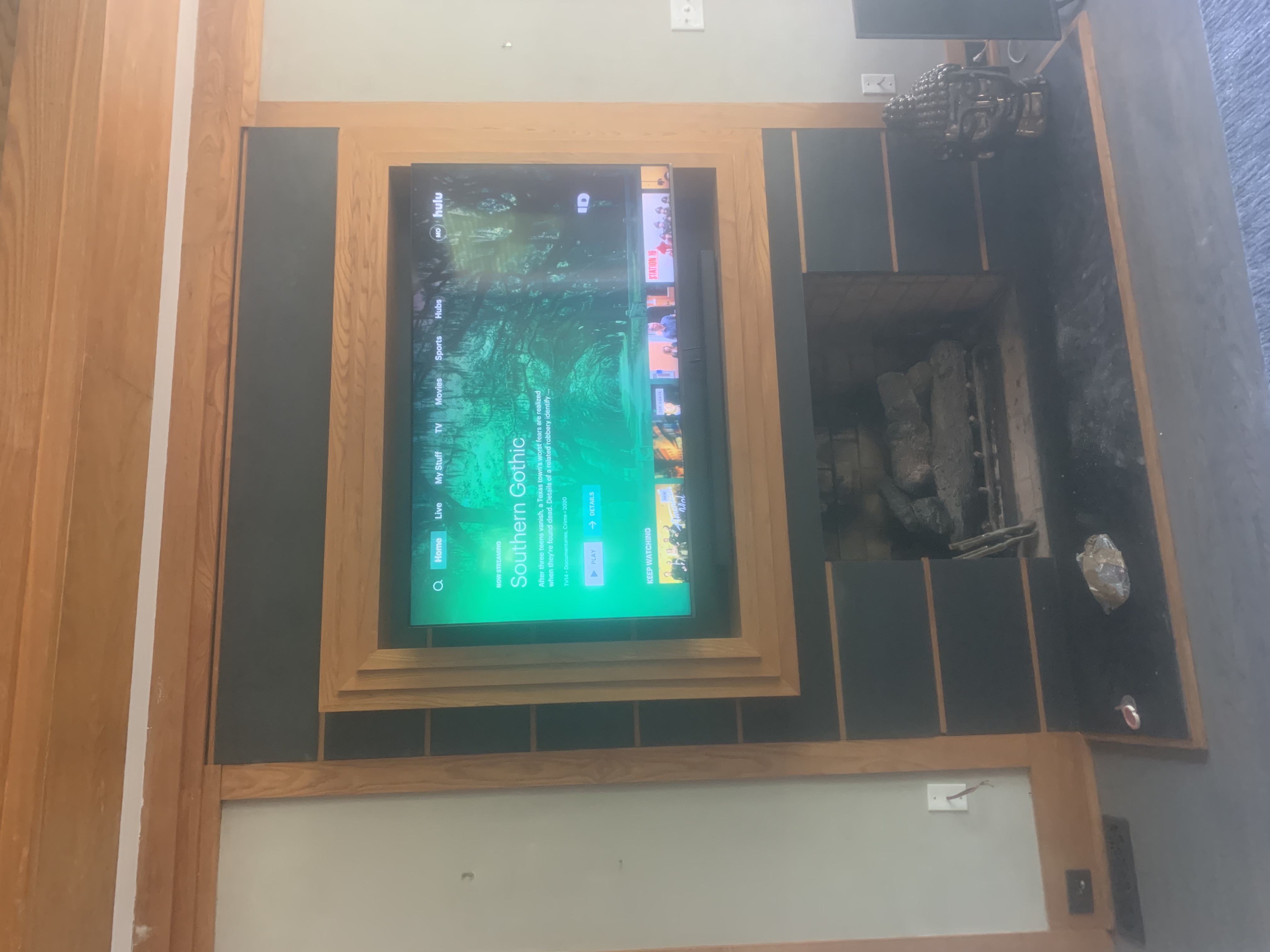 Full-motion TV mounting on drywall wall in living room, Charleston SC