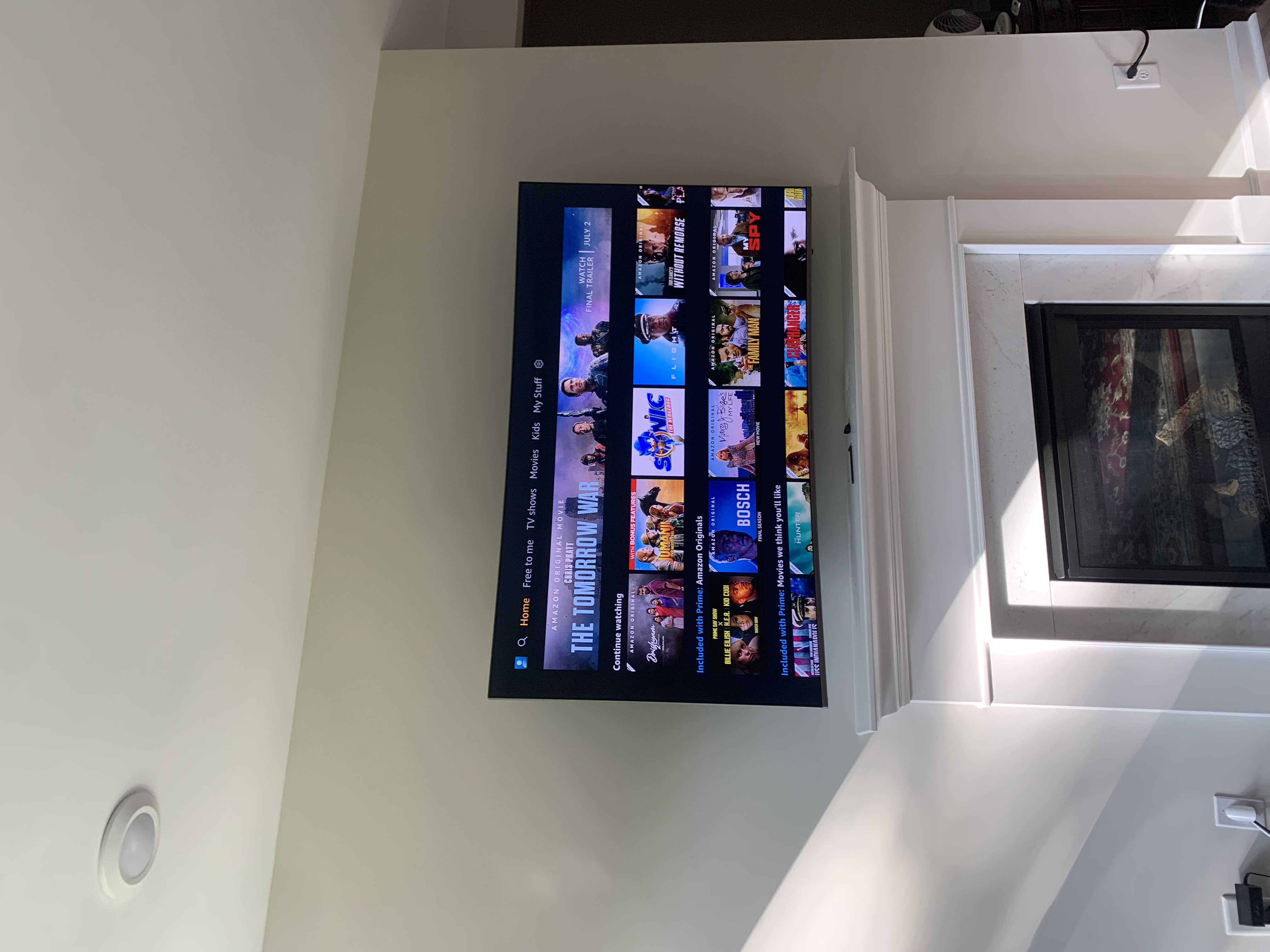 Fixed TV mounting on drywall wall in living room, service area