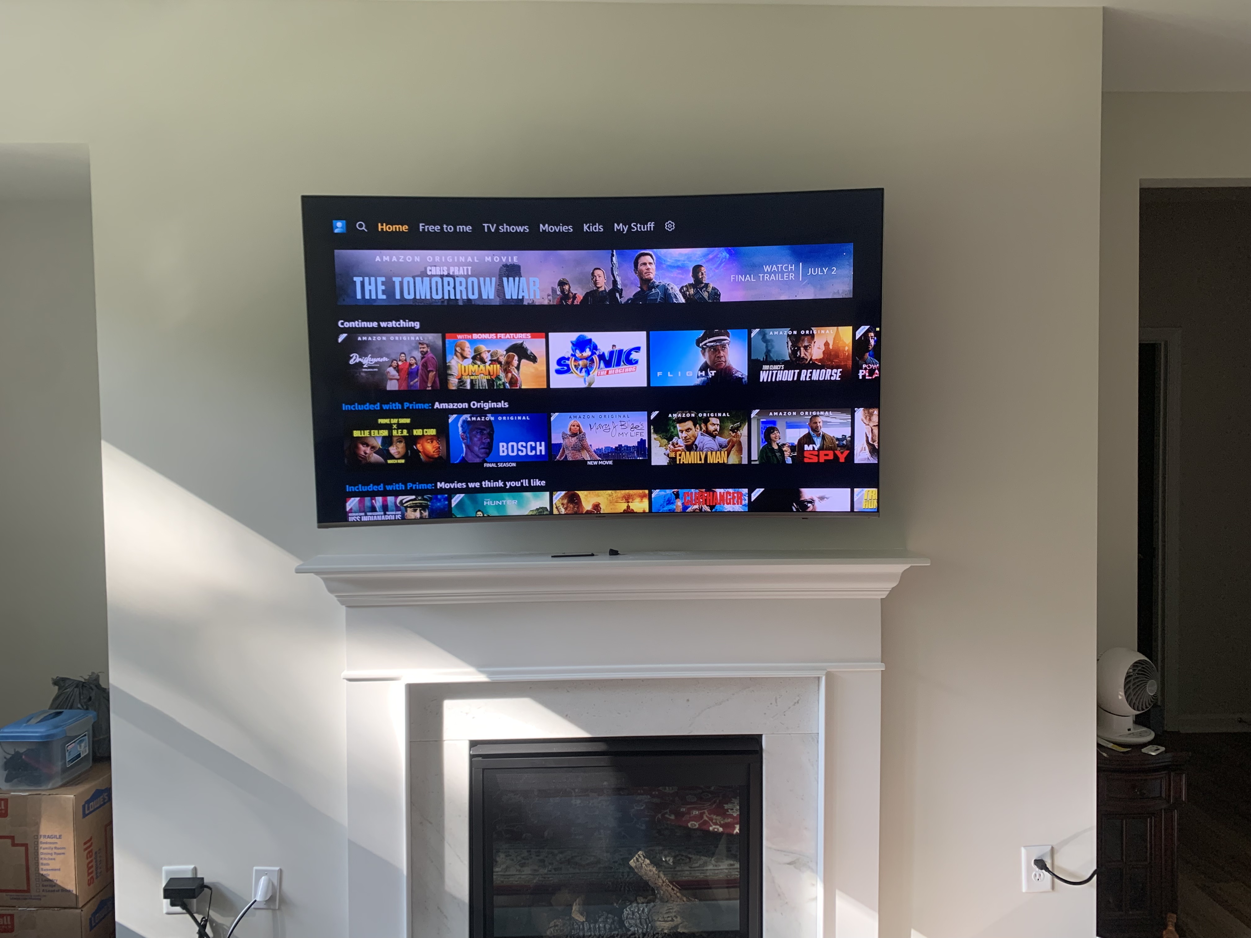 Full-motion TV mounting on drywall wall in living room, service area