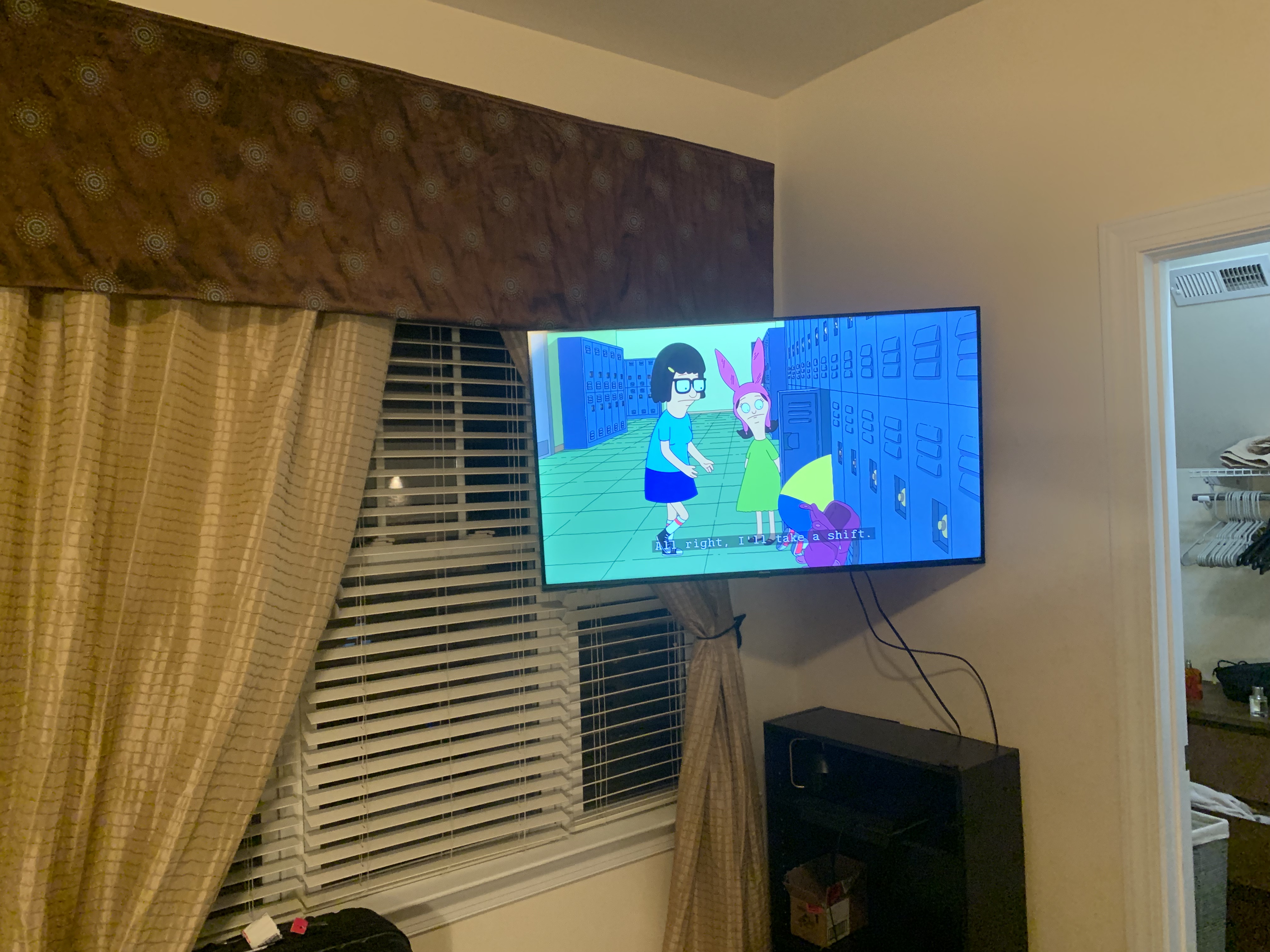 Full-motion TV mounting on drywall wall in living room, Charlotte NC