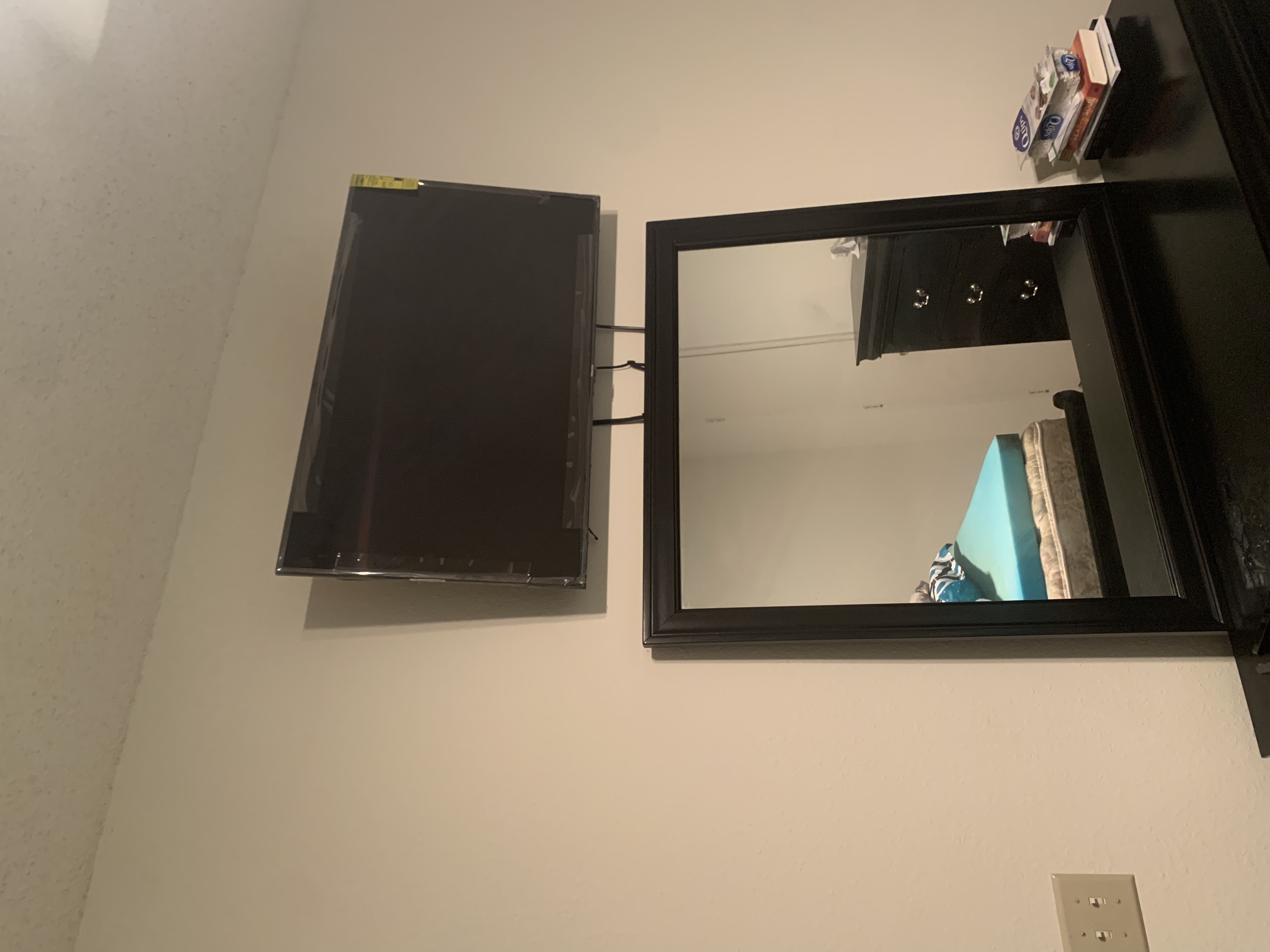 Fixed TV mounting on drywall wall in living room, service area