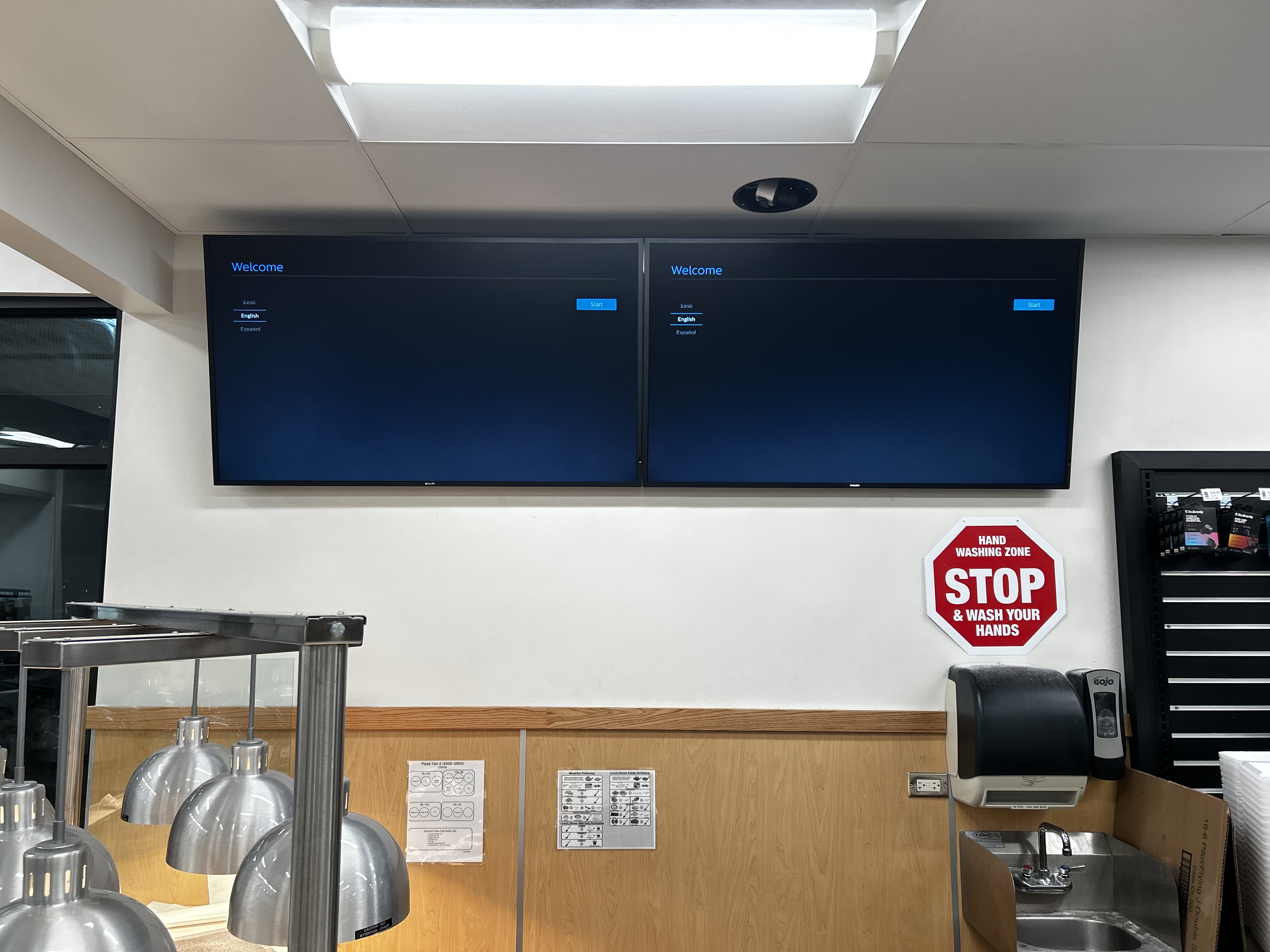 Full-motion TV mounting on drywall wall in living room, service area