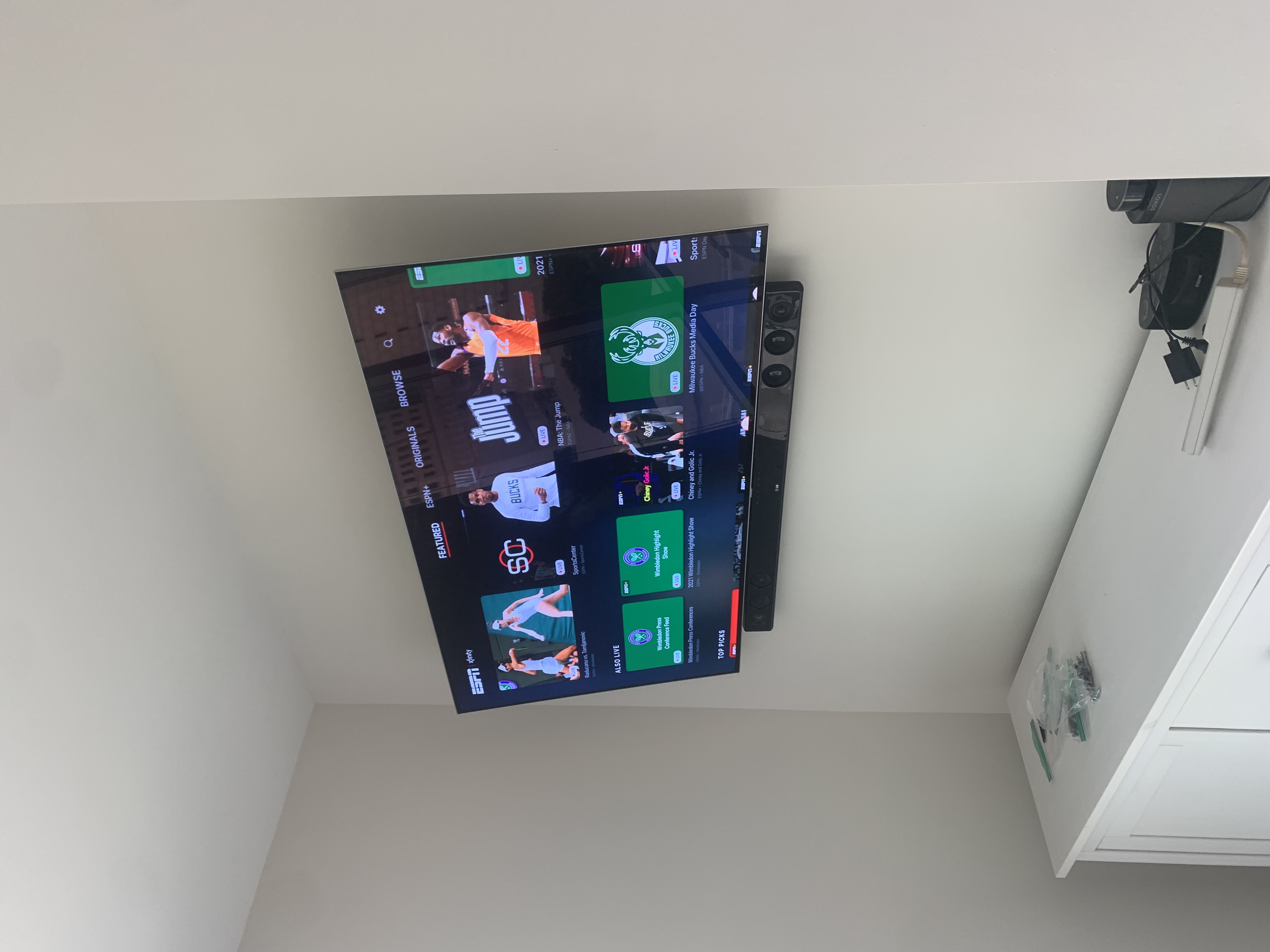 Fixed TV mounting on drywall wall in living room, service area