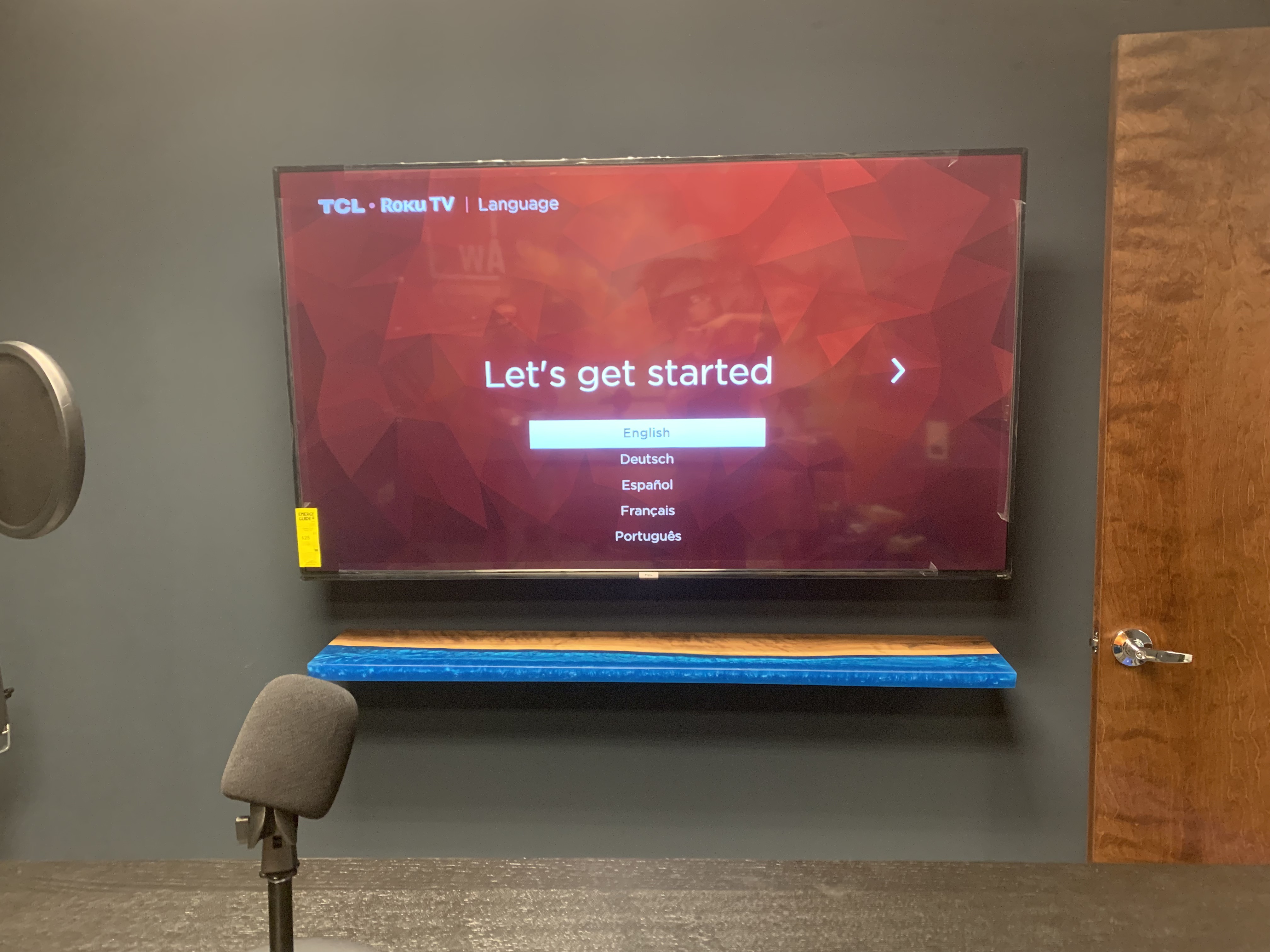 Tilting TV mounting on drywall wall in living room, service area