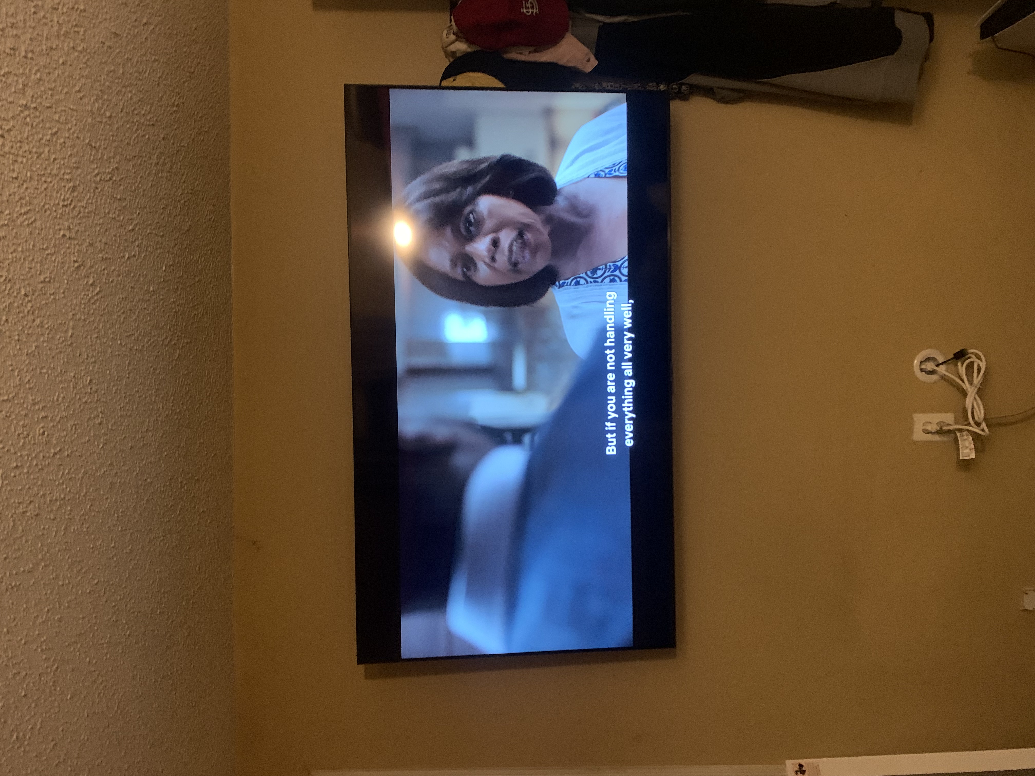 Fixed TV mounting on drywall wall in living room, service area