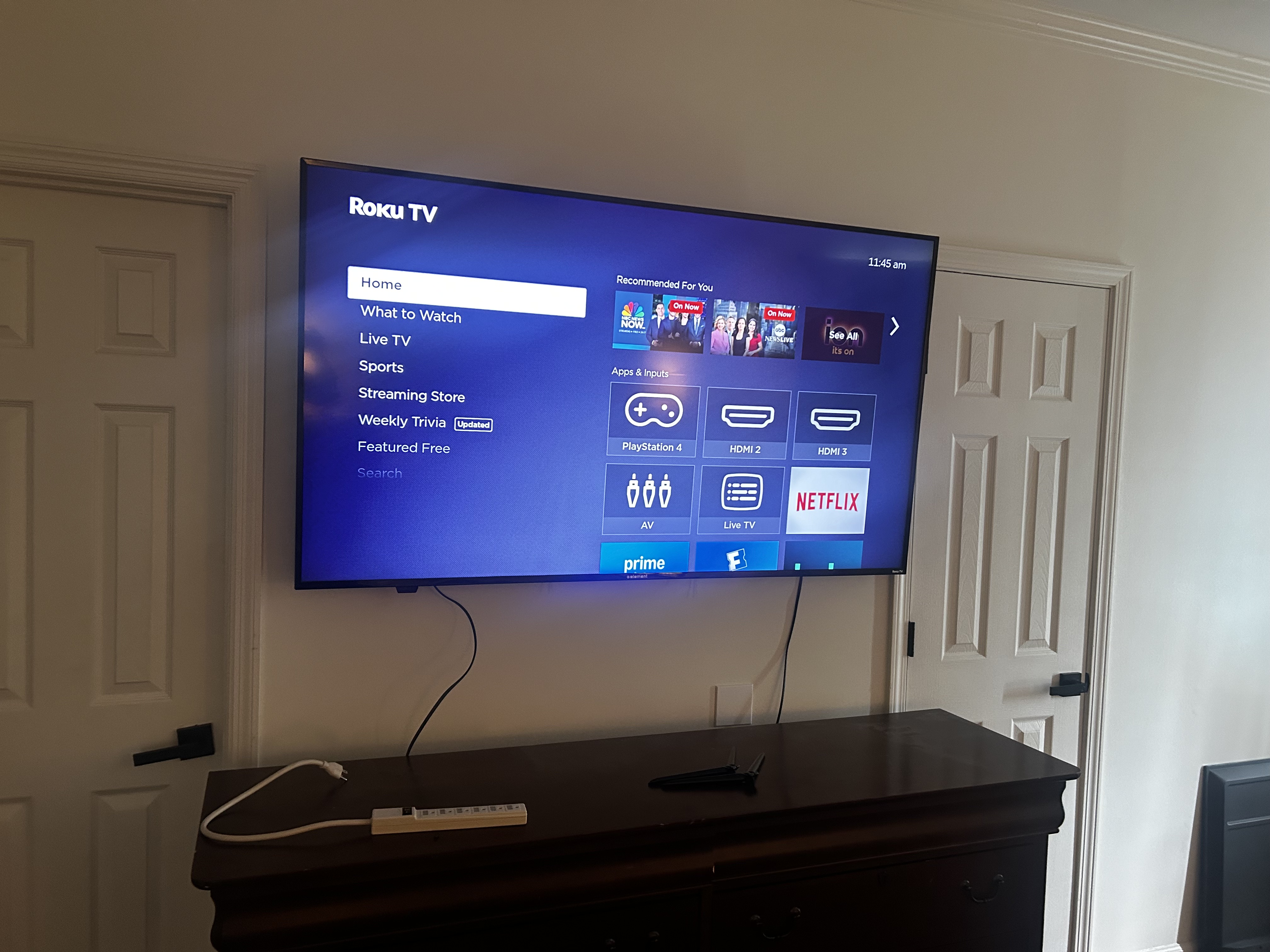 Fixed TV mounting on drywall wall in living room, service area