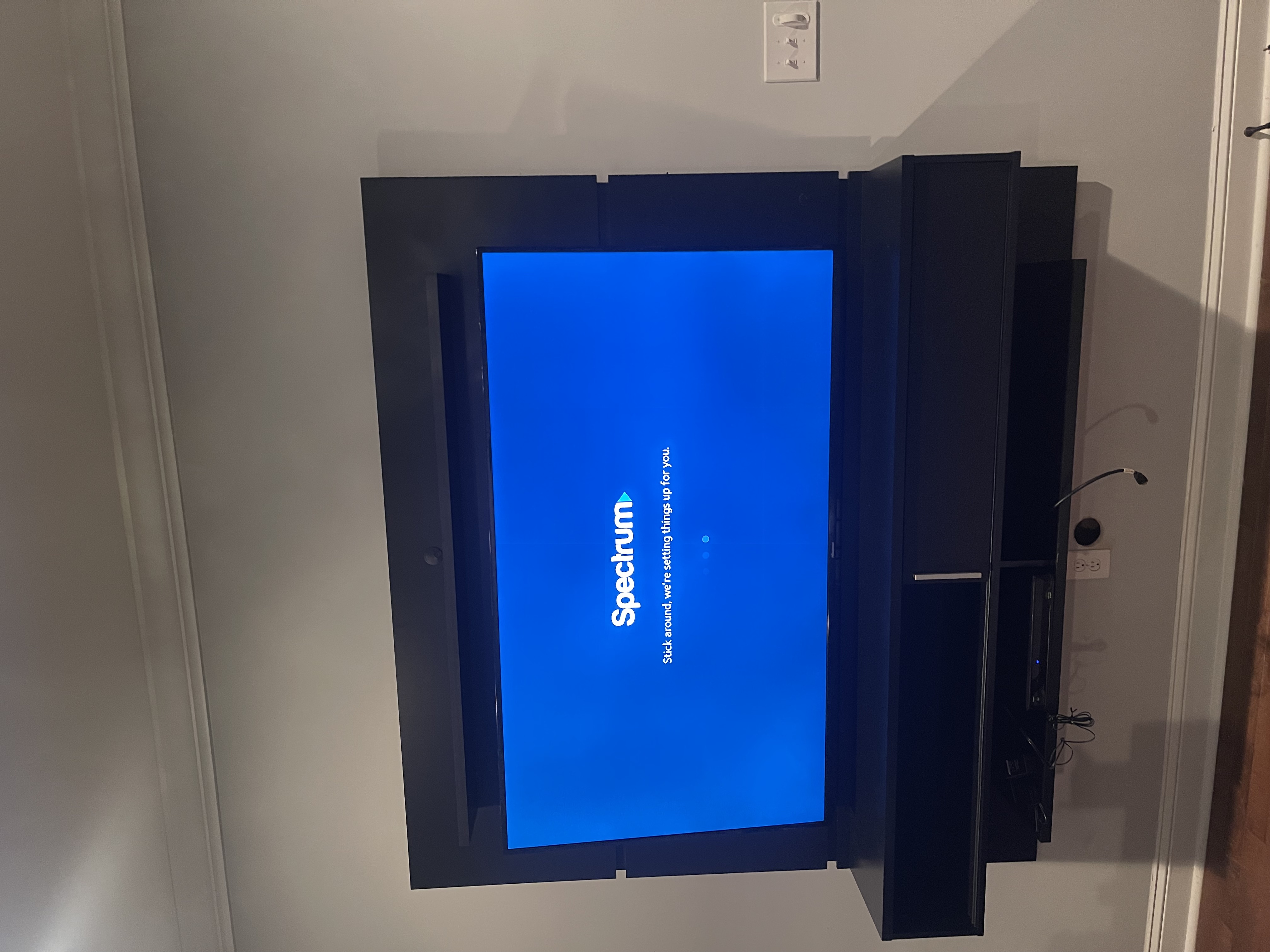 Full-motion TV mounting on drywall wall in living room, Charleston SC