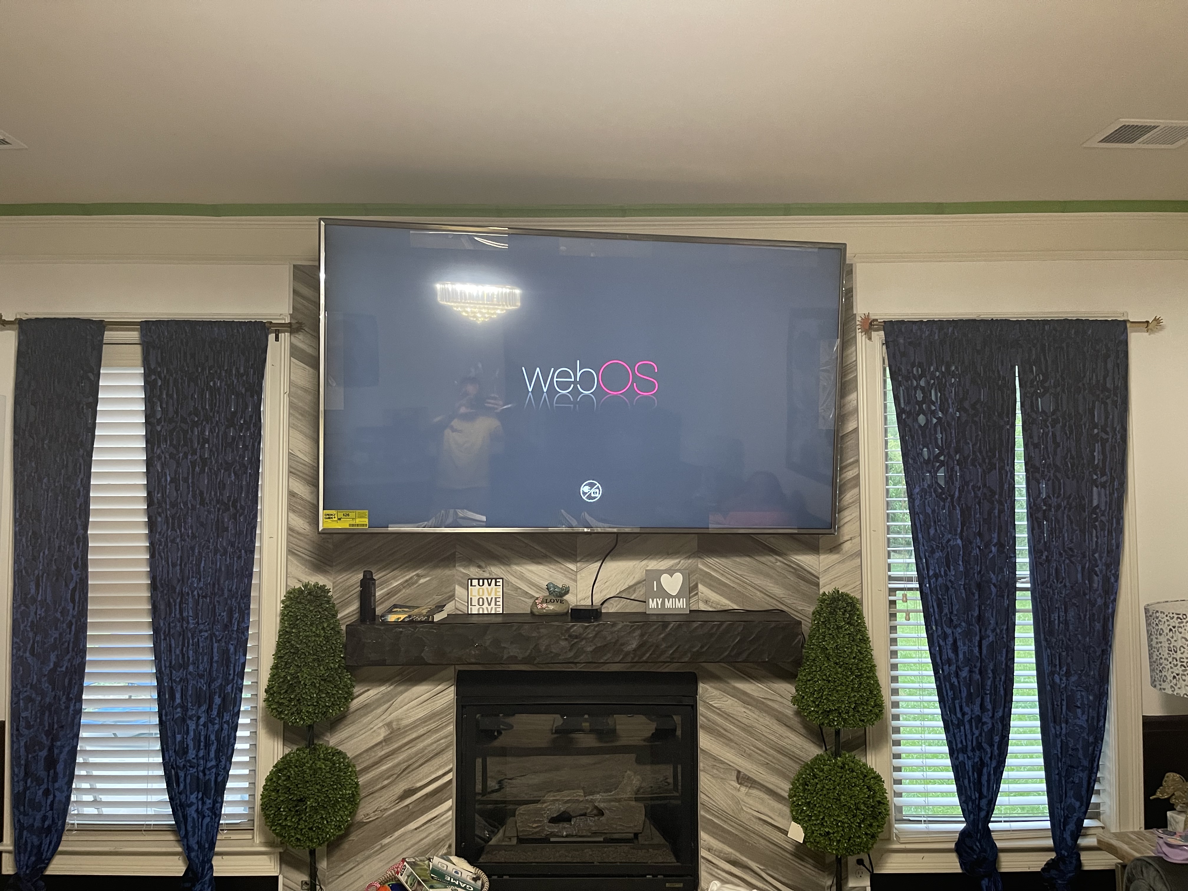 Full-motion TV mounting on drywall wall in living room, Columbia SC