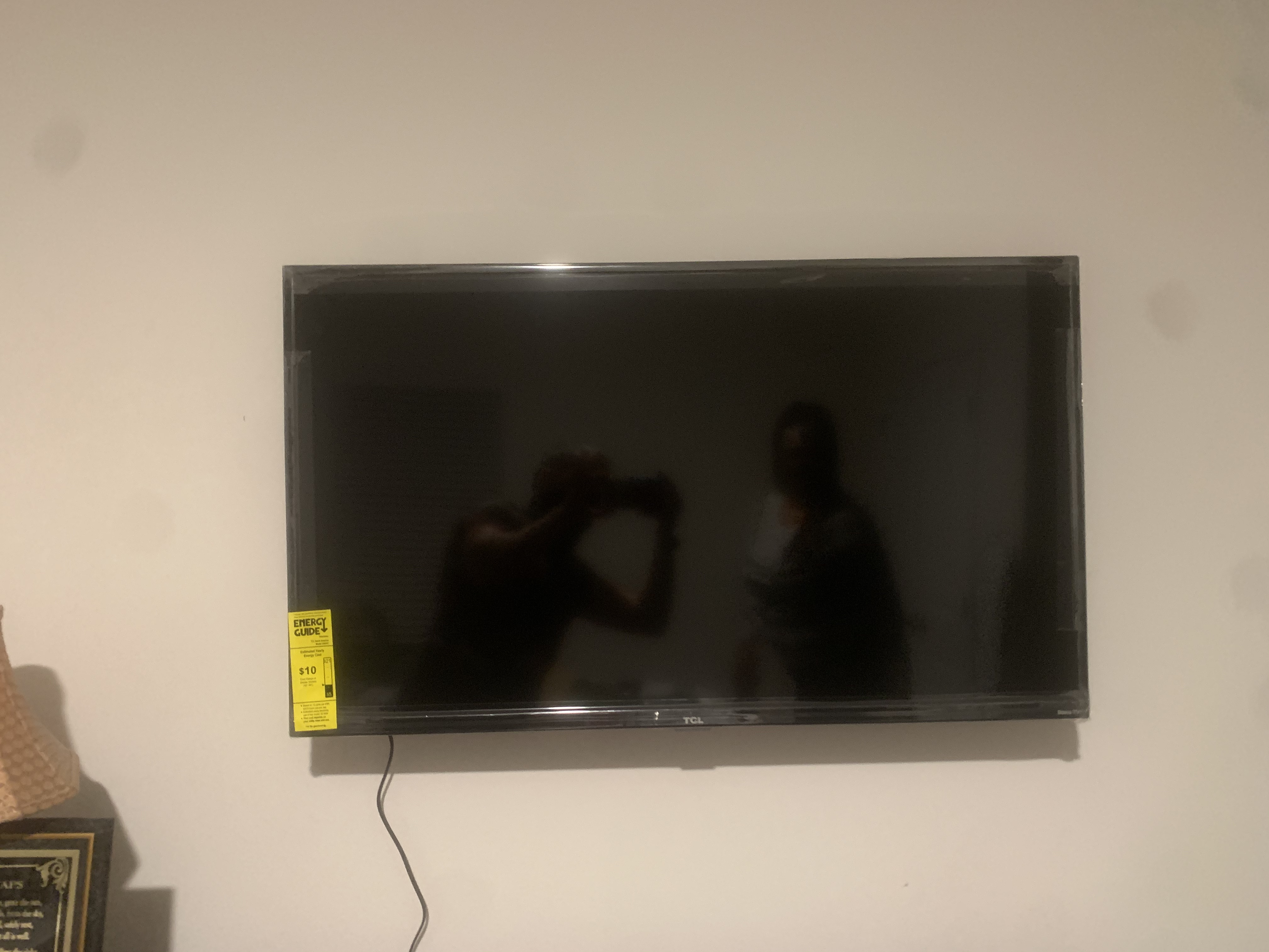 Fixed TV mounting on drywall wall in living room, service area