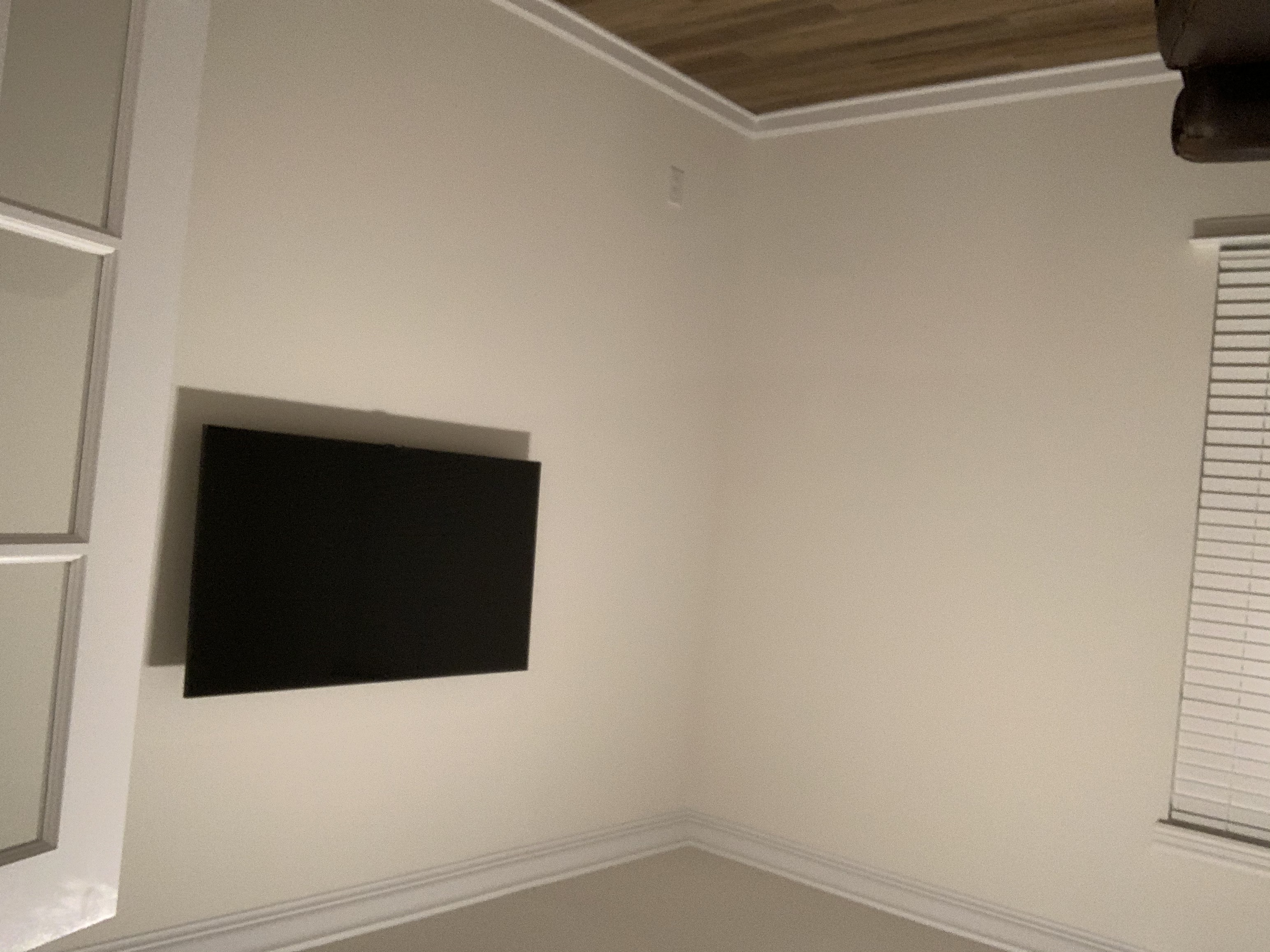 Full-motion TV mounting on drywall wall in living room, Columbia SC