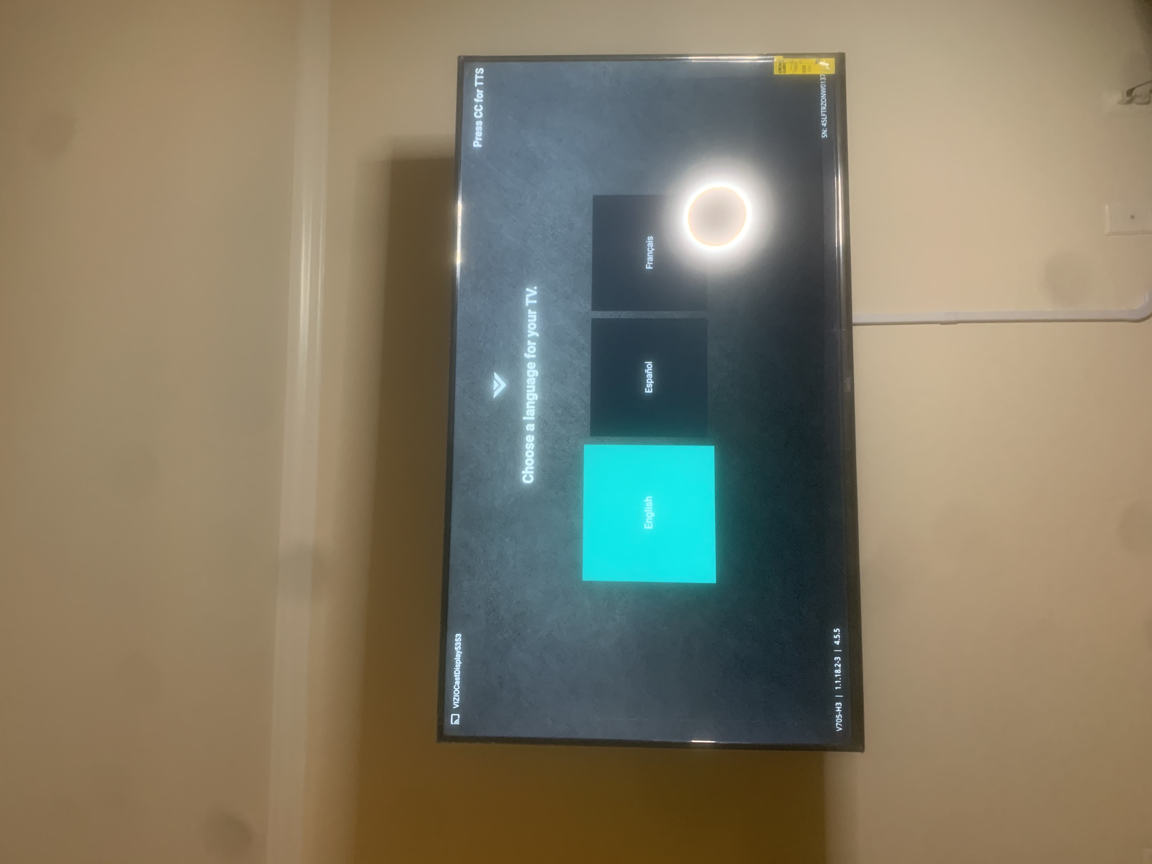 Full-motion TV mounting on drywall wall in living room, service area