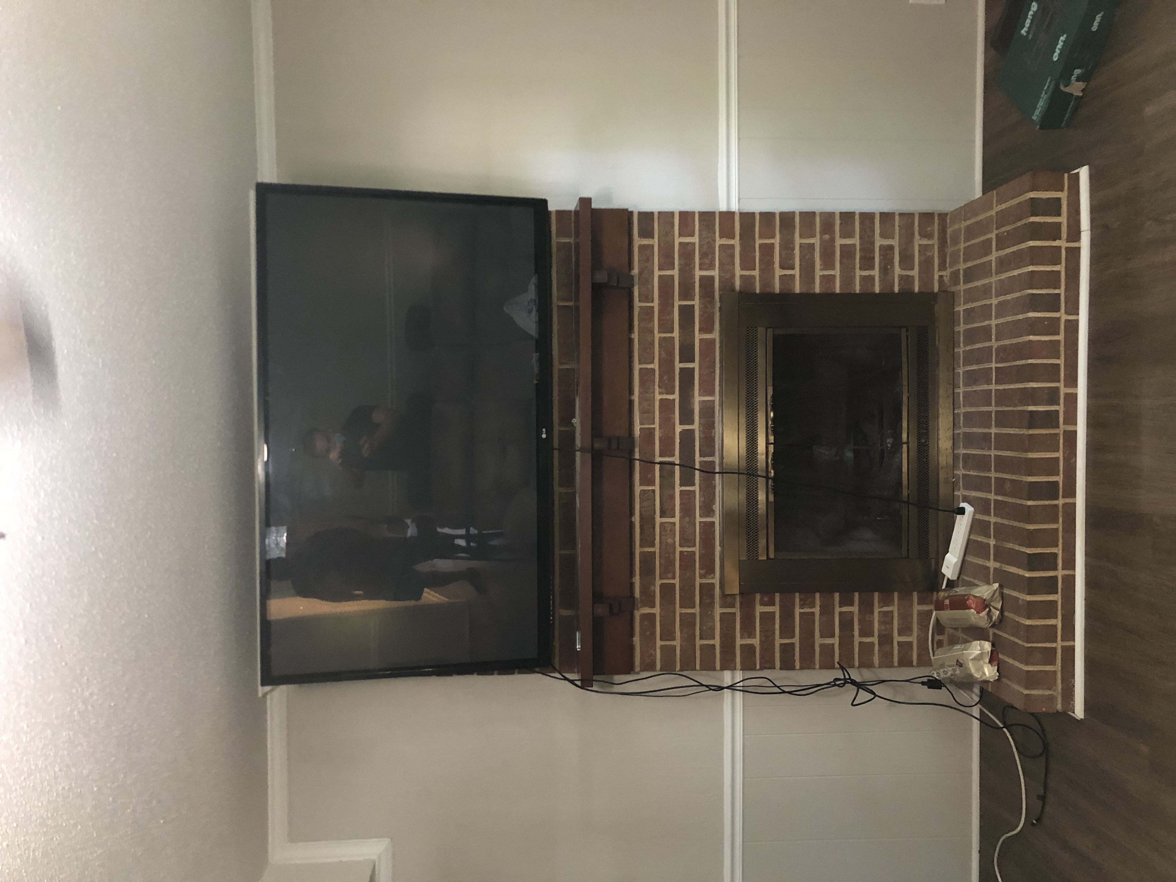 75-inch TV centered on feature wall with full cable management in Irmo, SC