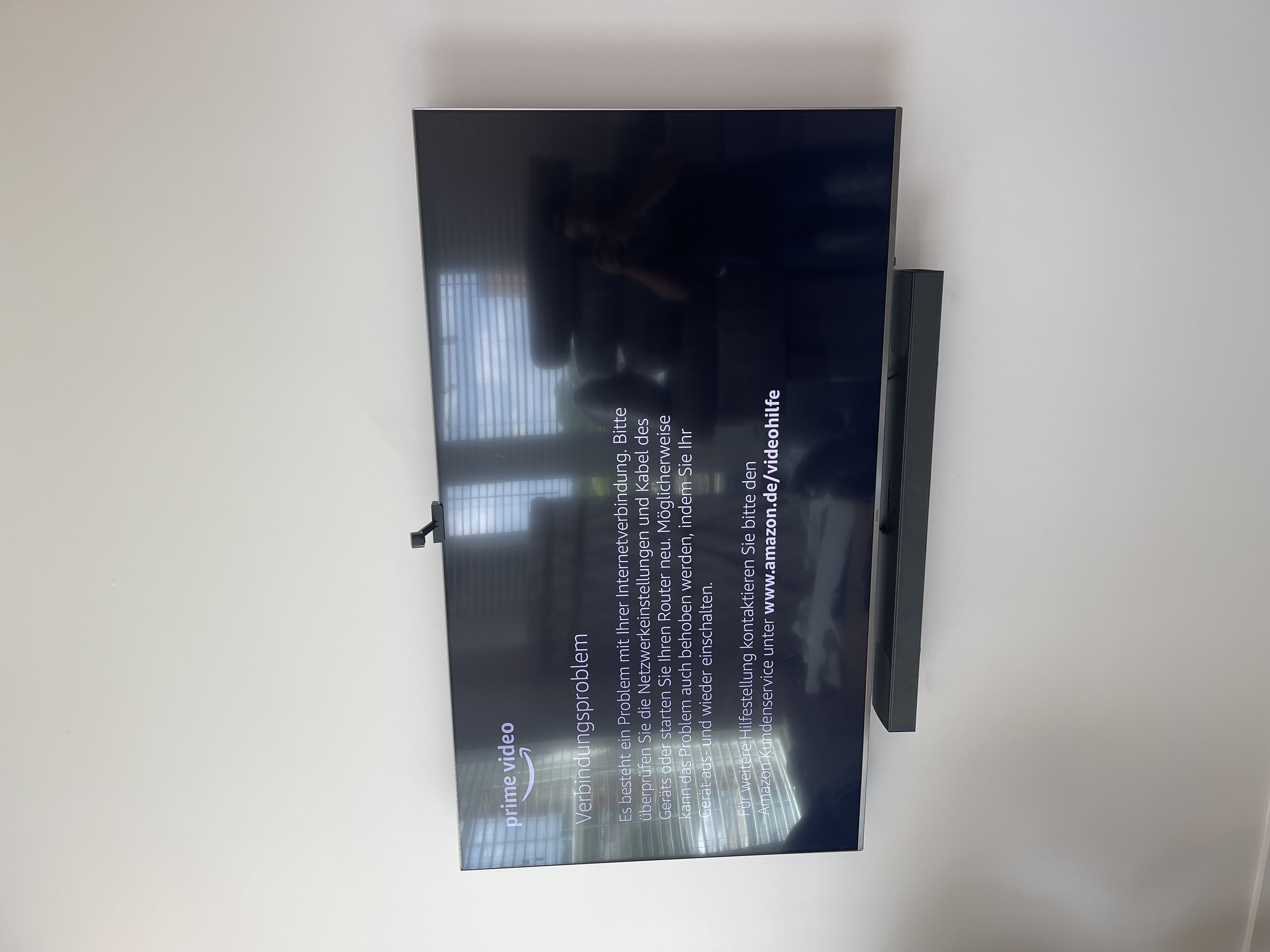 Tilting TV mounting on drywall wall in living room, service area