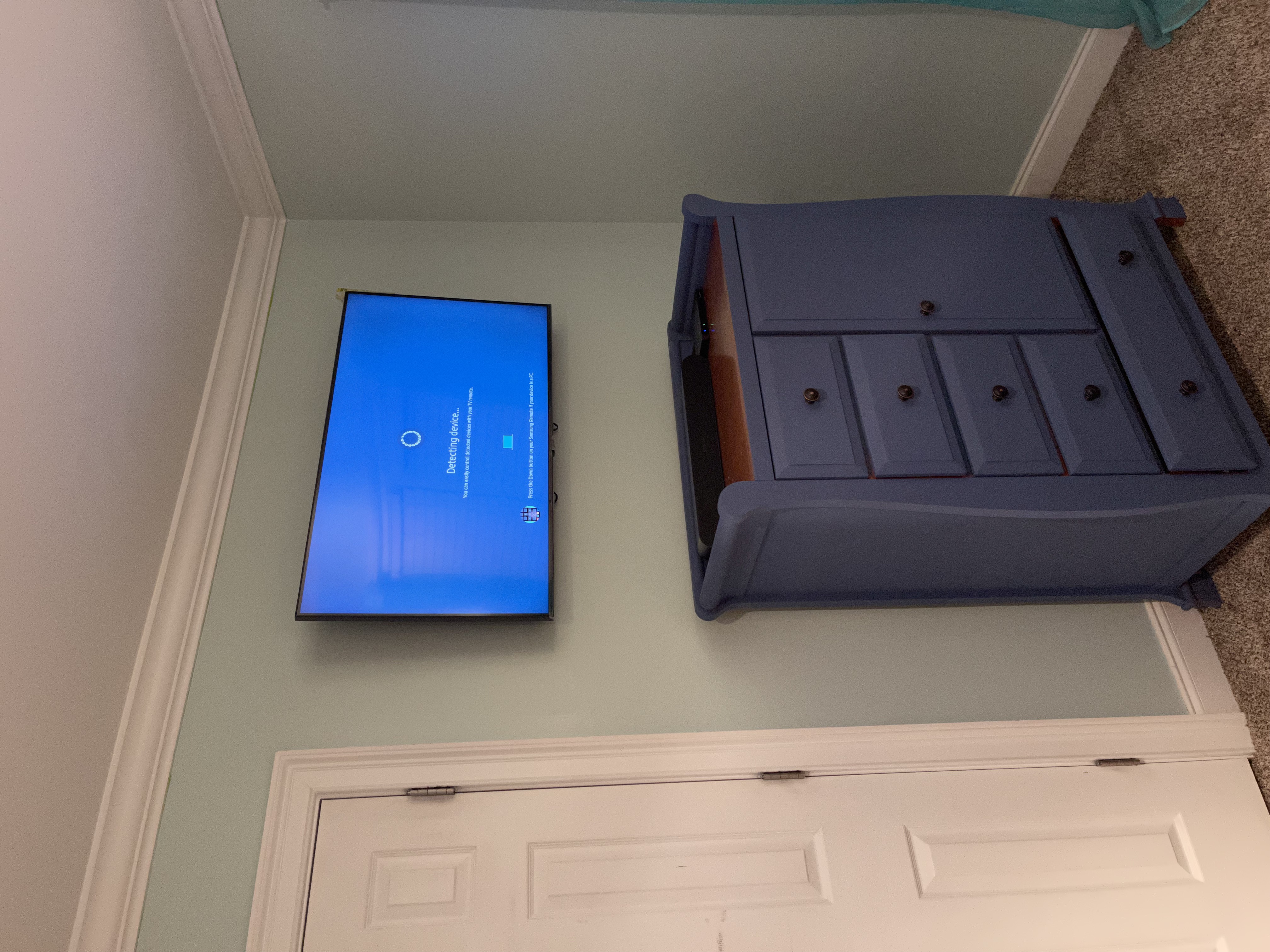 Fixed TV mounting on drywall wall in living room, service area