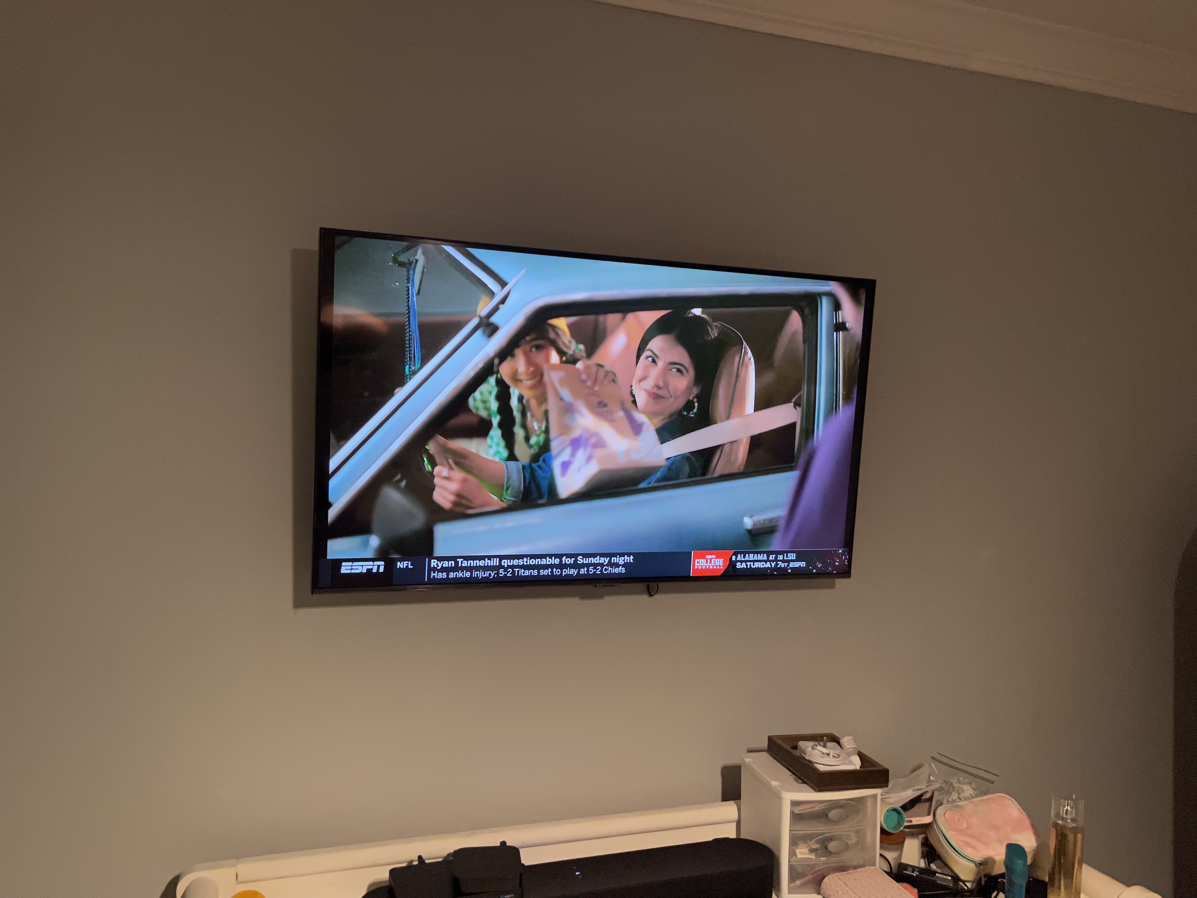Full-motion TV mounting on drywall wall in living room, service area