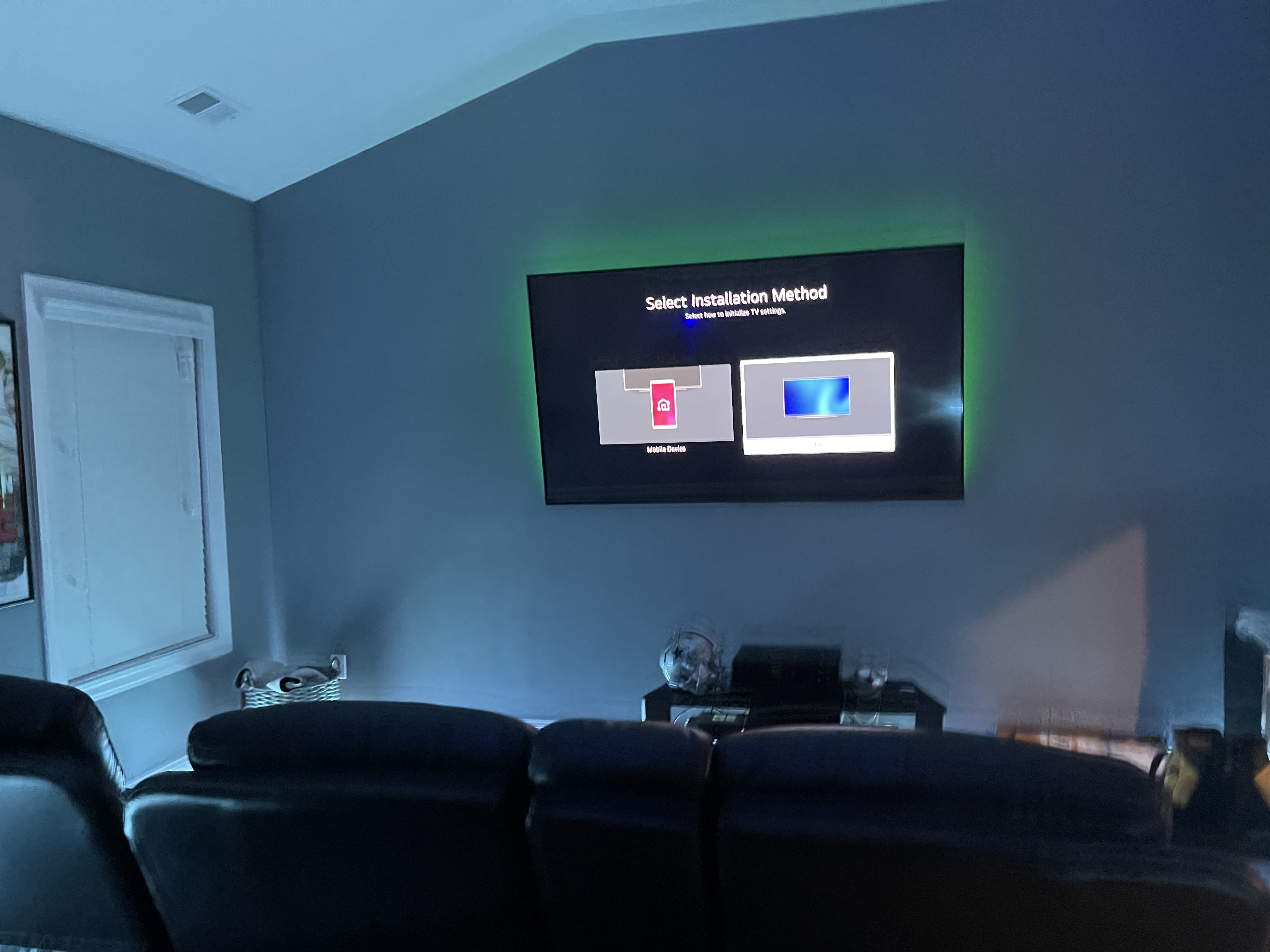 Fixed TV mounting on drywall wall in living room, service area